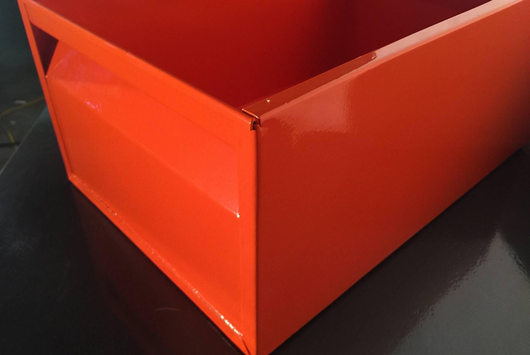 We refinished our fantastic 1940s Industrial storage bin in a gloss orange powder coat. This Classic, heavy-duty steel organizer is sure to keep your office in tip-top shape.