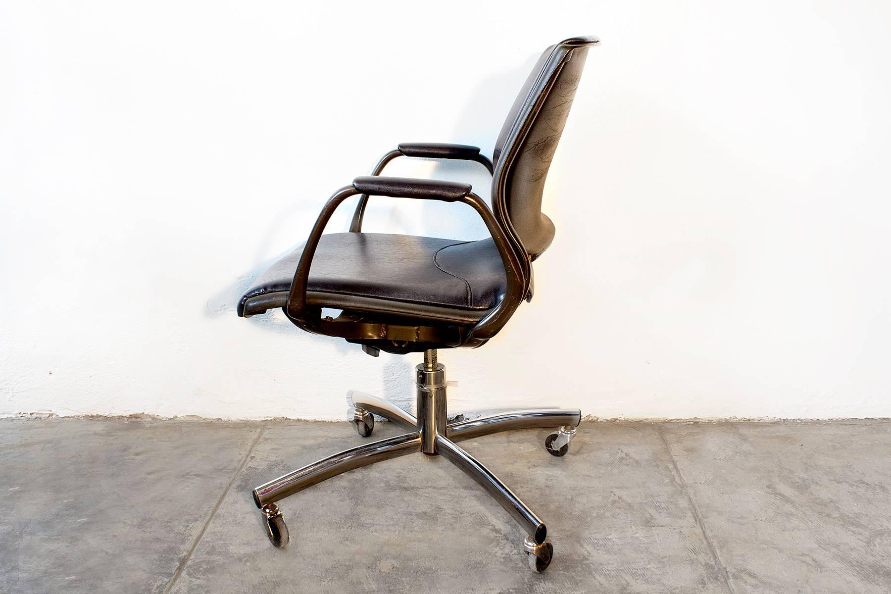 Very cool 1980s era steelcase office chair with steel base and reupholstered vinyl seat. This mod seat tilts, swivels and adjusts.