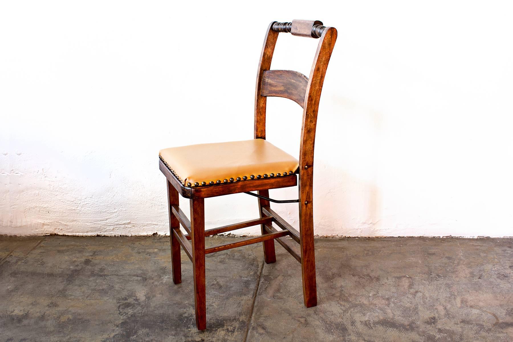 Beautiful pair of mission style folding chairs composed of solid carved oak. Reconditioned wood. Newly reupholstered vinyl seats with upholstery tacks. Quite a lovely and uncommon set!, circa 1930s. 

Dimensions: 15