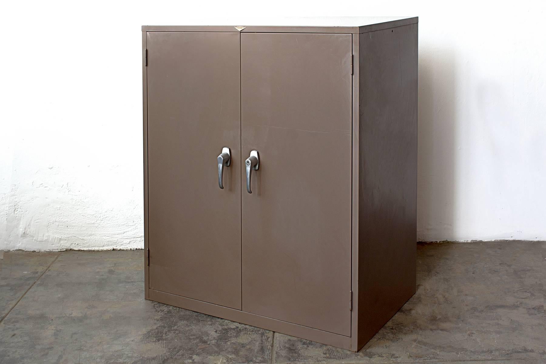Authentic, all-American file cabinet system by Cole Steel, circa 1960. This heavy duty steel piece features two letter card drawers, four filing drawers and a safe compartment. Safe combination unavailable but door can be opened and code reset.