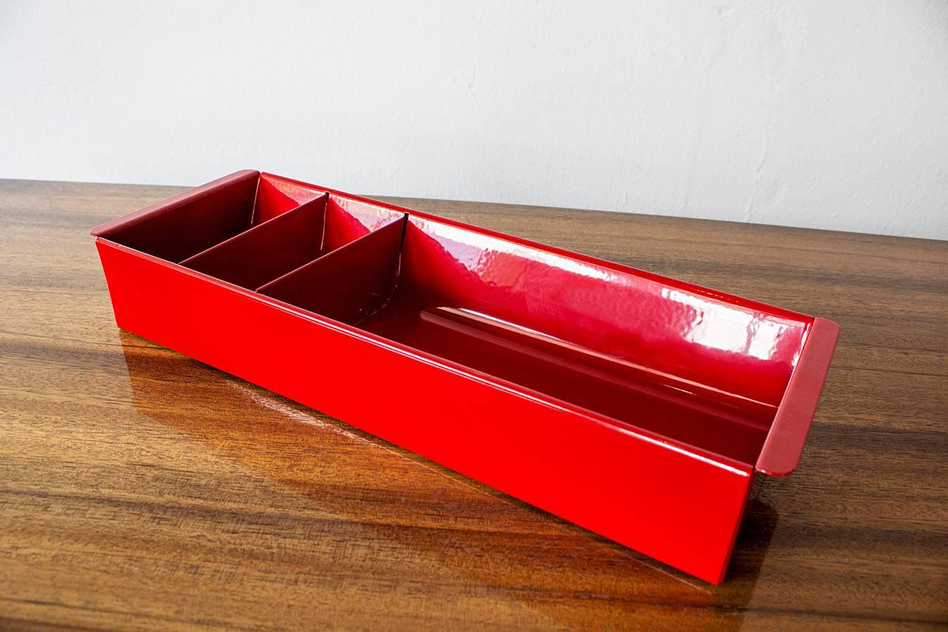 Once the insert to a Classic tanker desk's utility drawer, we repurposed this neat Industrial piece for use as a desktop organizer. Steel has been newly powder-coated in a pop of red. Features three slots, ideal for storing coins, pens and pencils