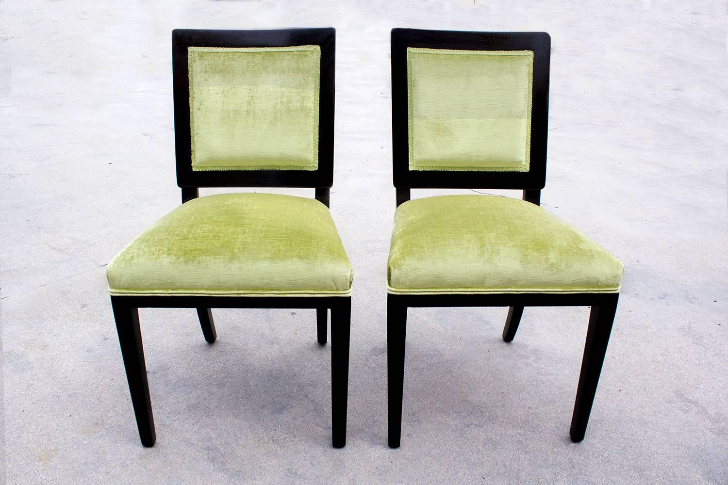 Pair of lovely Dunbar dining chairs, circa 1940. Refinished in dark walnut and reupholstered seats in Brussels velvet. Excellent refinished condition.

Dimensions: 20