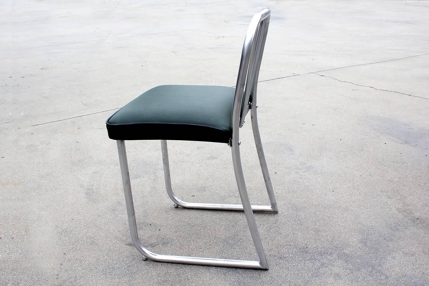 Uncommon Art Deco-era nurses chair, circa 1930s. Sculptural steel frame with unique V-shape back. Newly reupholstered seat in high-quality green vinyl with black piping. Repainted steel.

Dimensions: 15.5