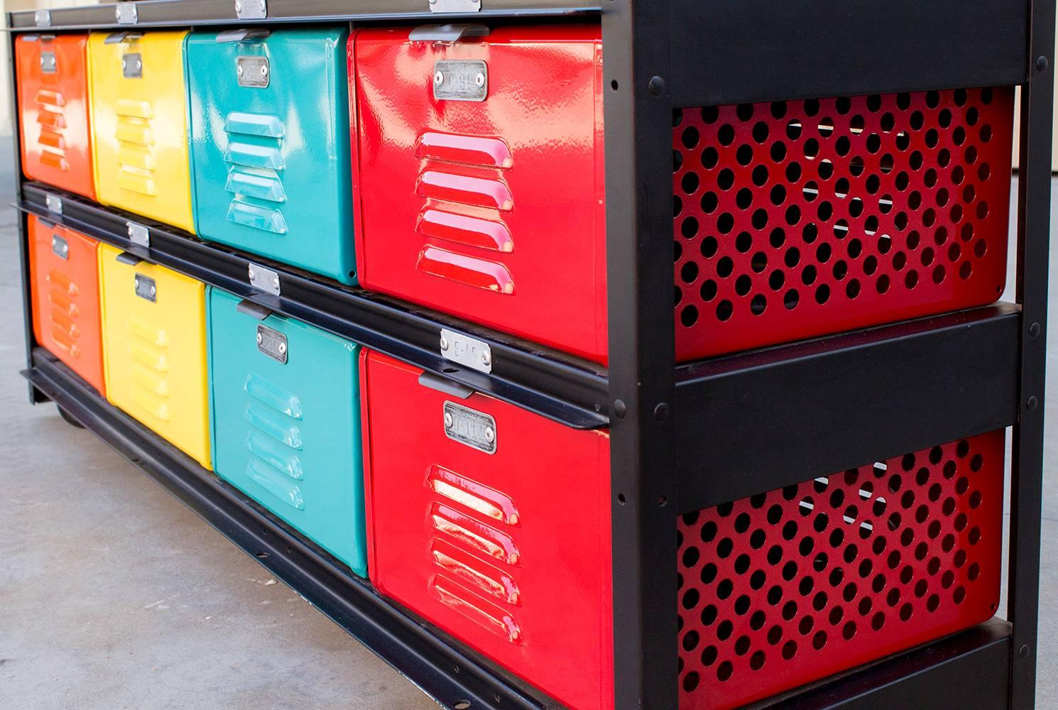 1960s refurbished vintage locker basket unit in 4 x 2 configuration. This rainbow colored unit features freshly powder coated baskets in tangerine, yellow, turquoise and ruby red all cased in a matte black frame on casters. 

Custom refinished to
