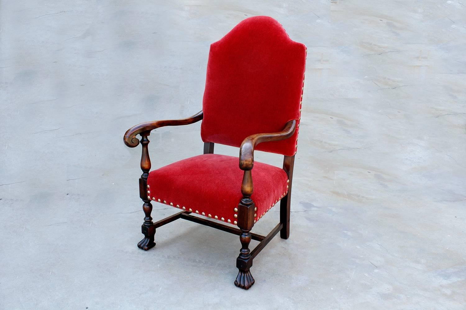 American Empire style armchair with tapered high back and ornate mahogany frame. This statement piece features reconditioned wood paired with rich red mohair upholstery, circa late 19th century.

Dimensions: 27