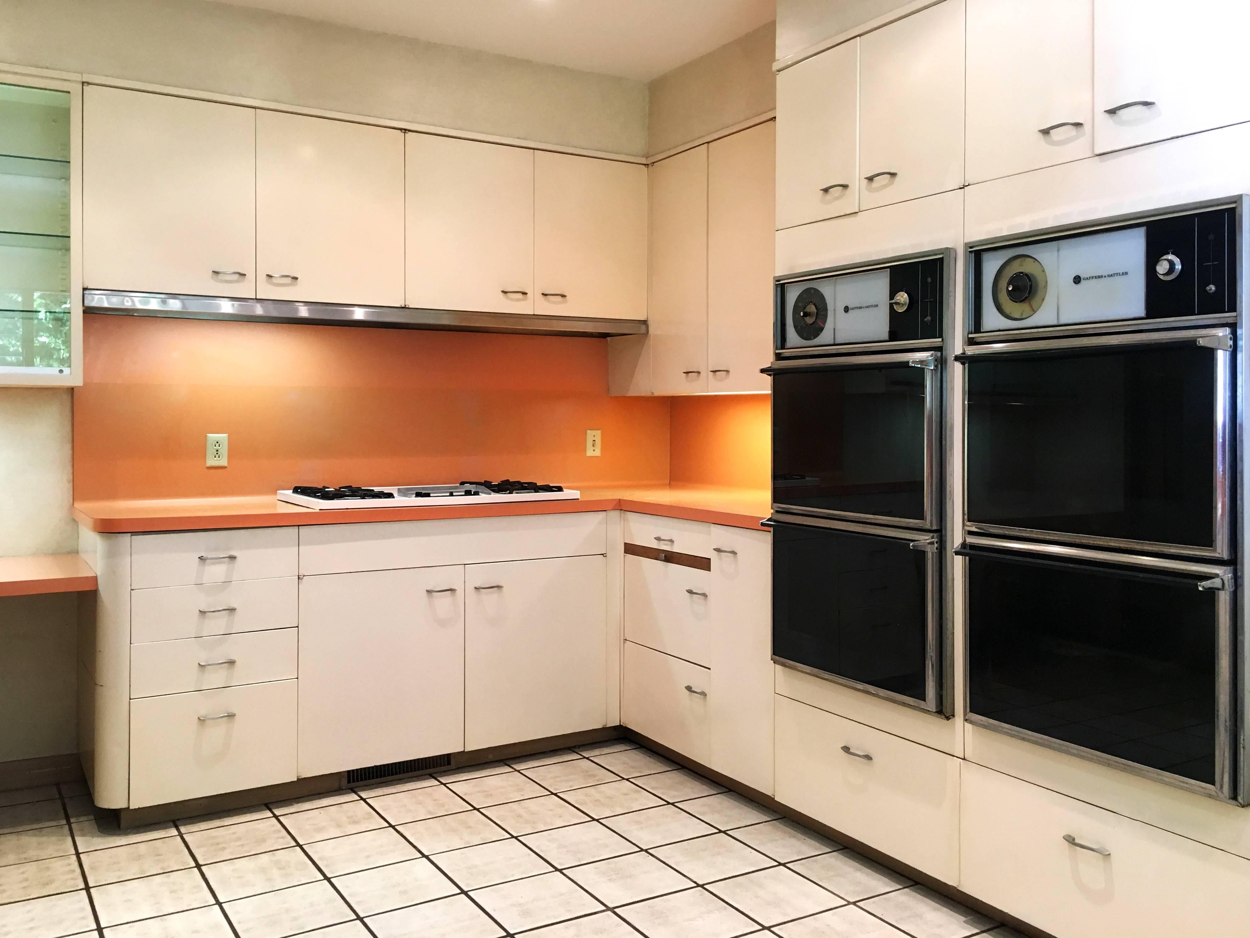 For sale is a coveted St. Charles midcentury modern kitchen and pantry, custom built in the early 1960s for a historic Beverly Hills estate. Includes six ceiling to floor walls of cabinets, glass displays, drawers, appliances and/ or lockers sold as