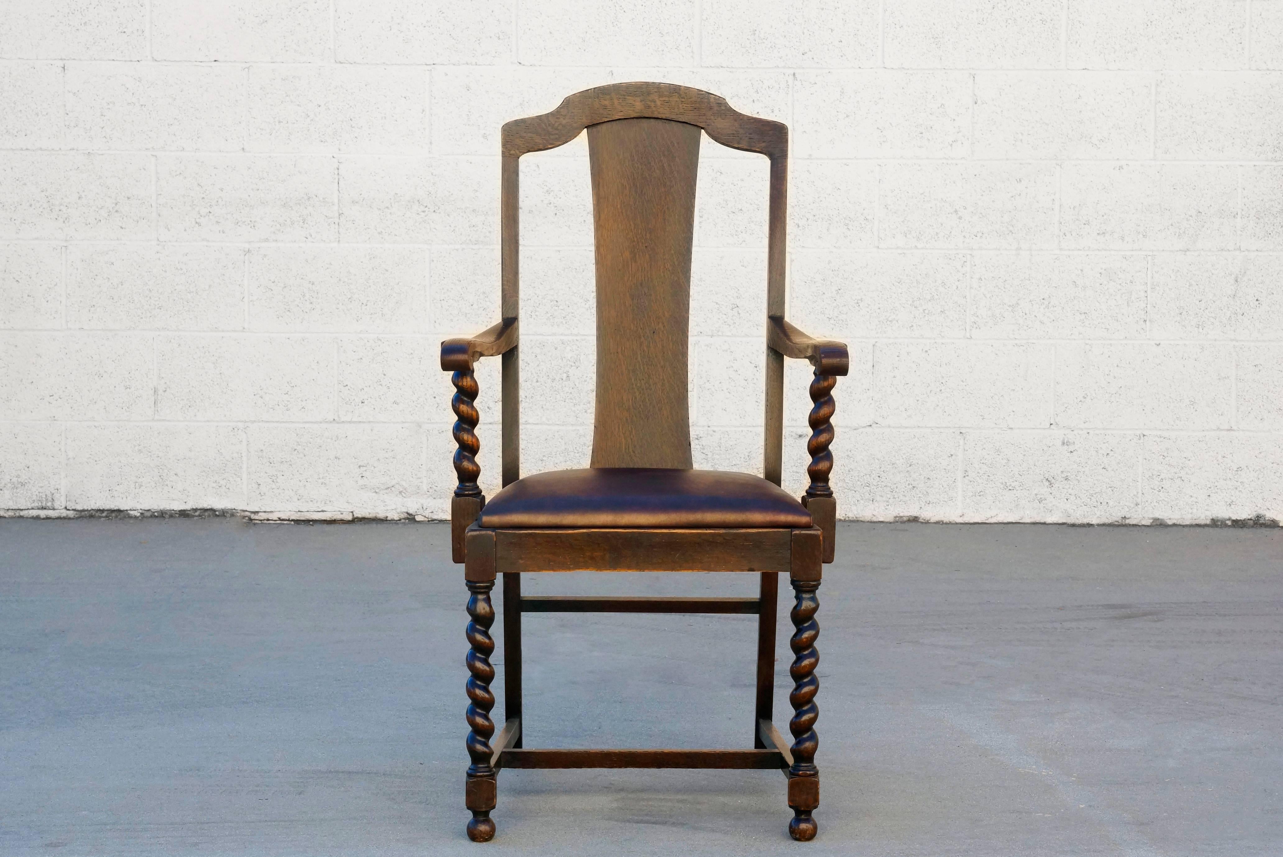 Antique barley twist armchair, circa early 1900s. Beautifully carved frame and tall slat back. Newly reupholstered in leather; reconditioned wood. 

Dimensions: 23
