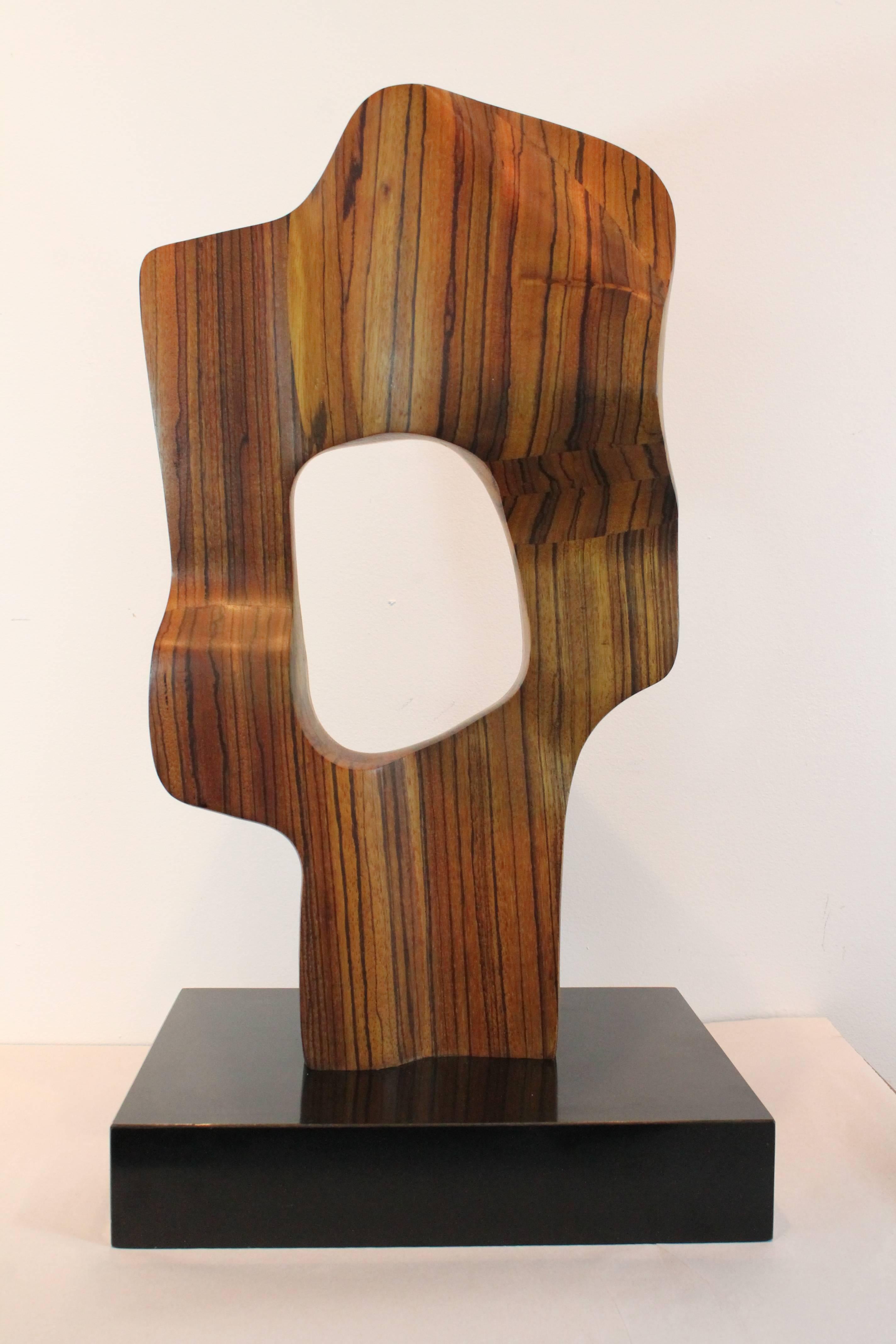 Powerful Modernist void sculpture that is incredible from every vantage.
Exceptionally constructed of zebra wood that is very precisely and sensitively executed in an organic undulating form. 
Mounted on an ebonized plinth.
Great scale.