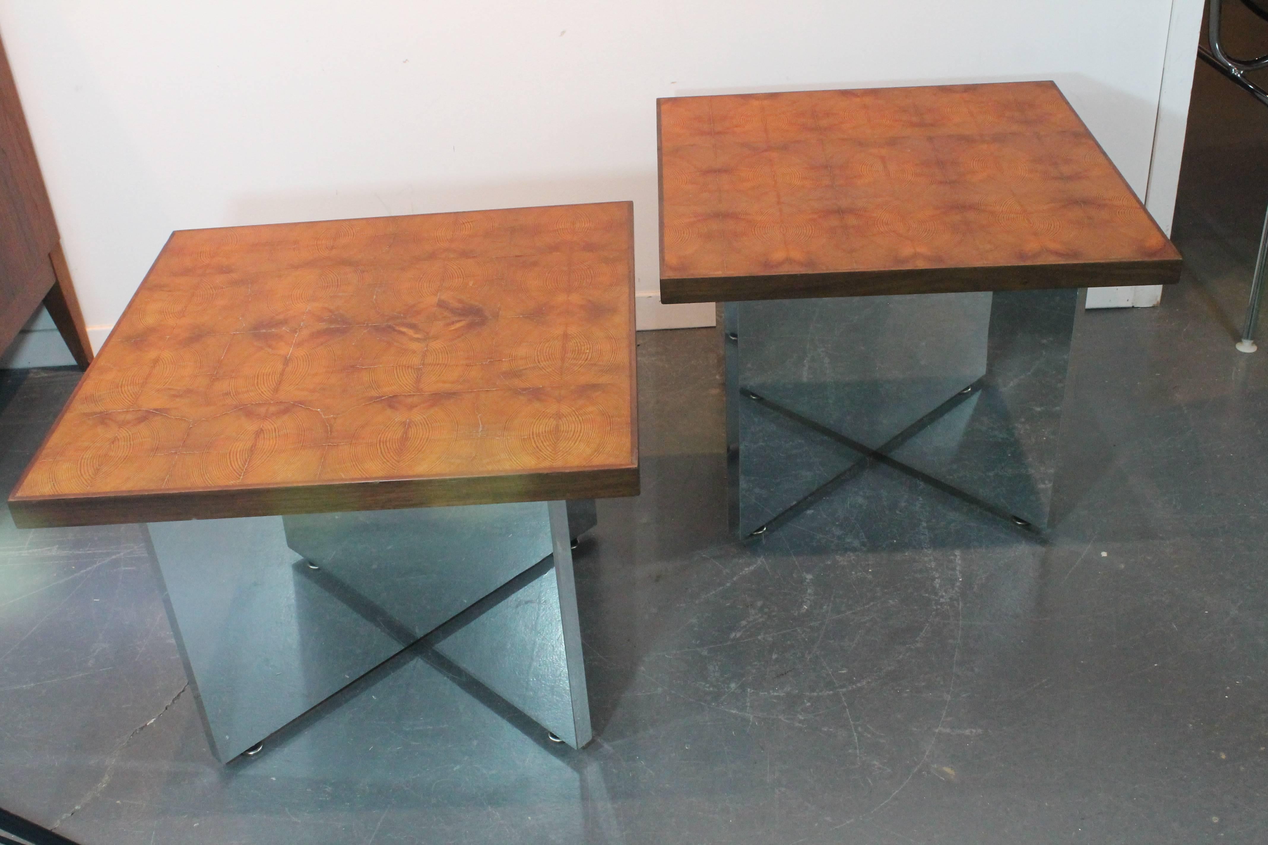 Great graphic Mid-Century Modern pair of high polished chrome X-based side tables.
The tops are bookended mosaic wood tiles trimmed in walnut.
Unusual and very graphic.
 