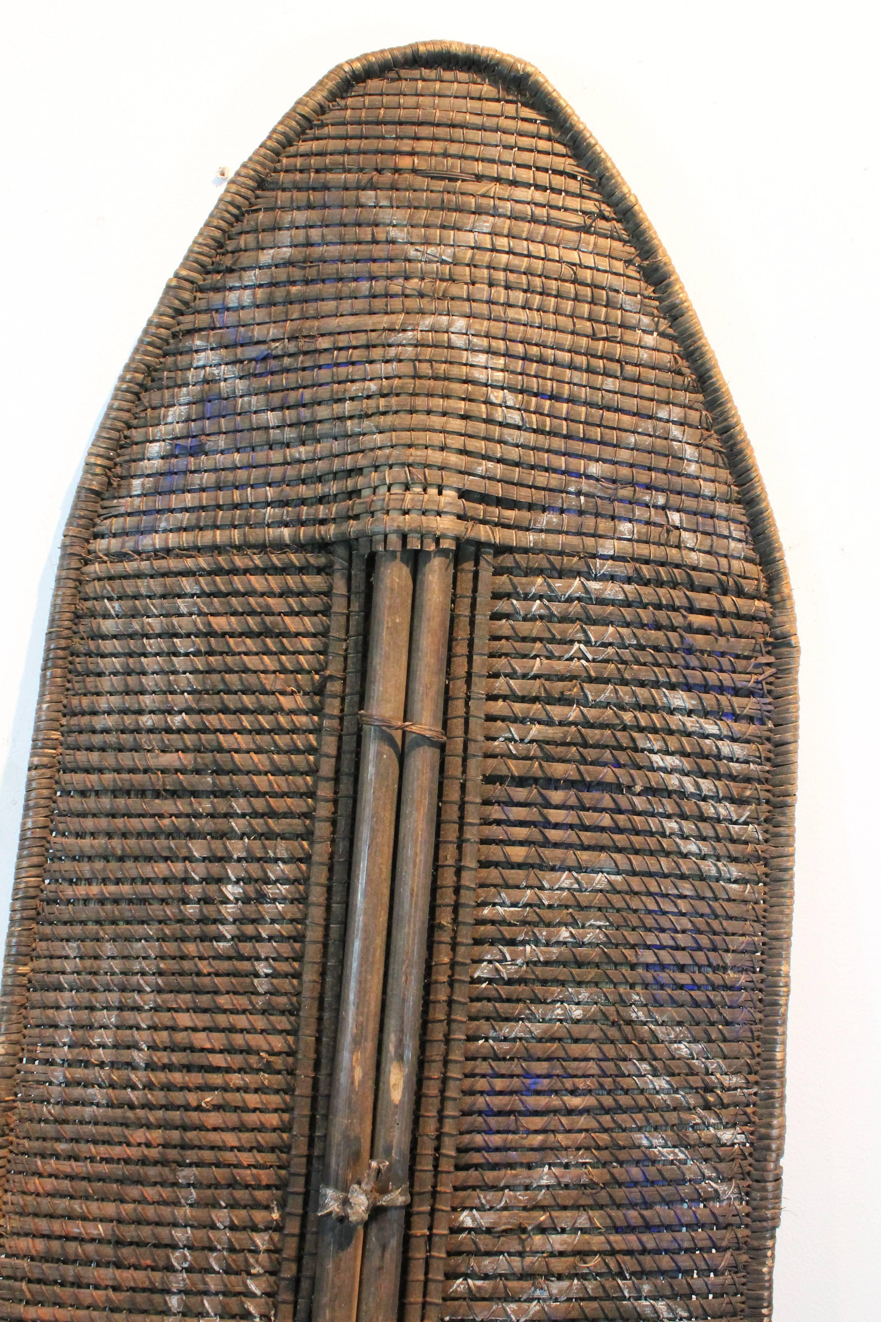Wonderful graphic woven rattan and natural pigment shield from the Ngandu people Congo.