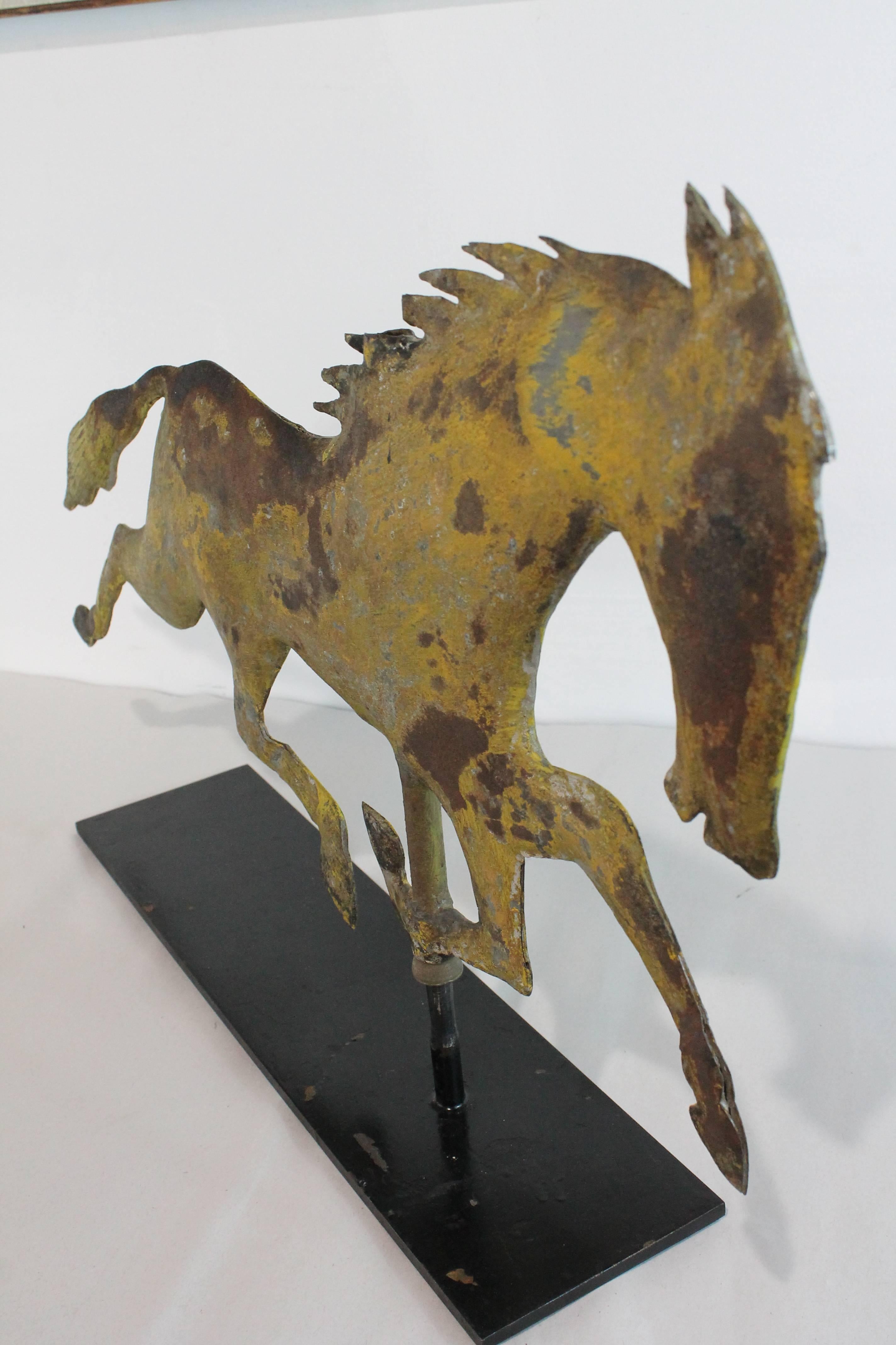 Great graphic quality to this handmade 19th century hollow bodied horse weathervane.
Remnants of original gilding with exceptional surface and patina.