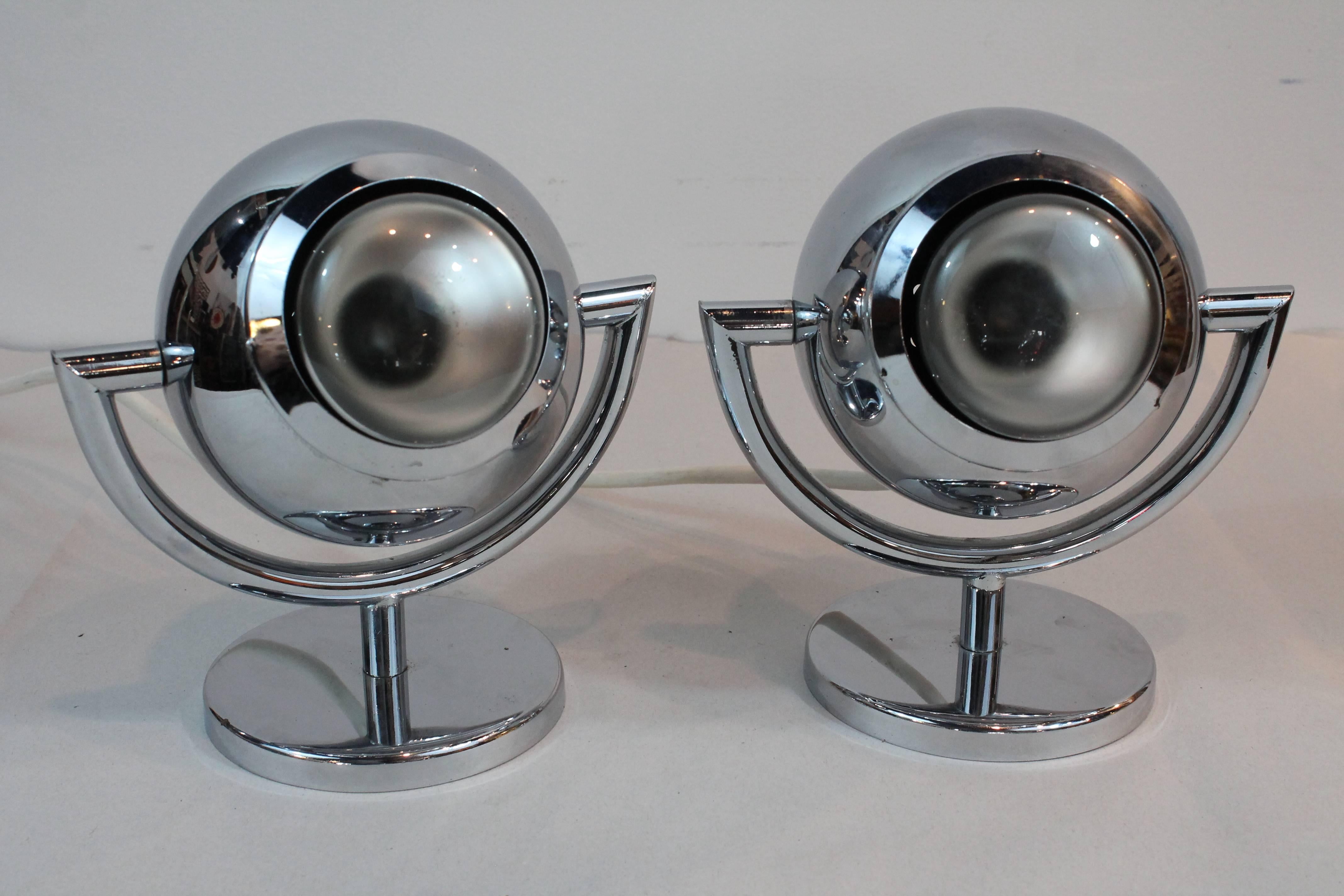 Great pair of sculptural chrome ball lamps that swivel on the base and from the sculptural arms.
                  