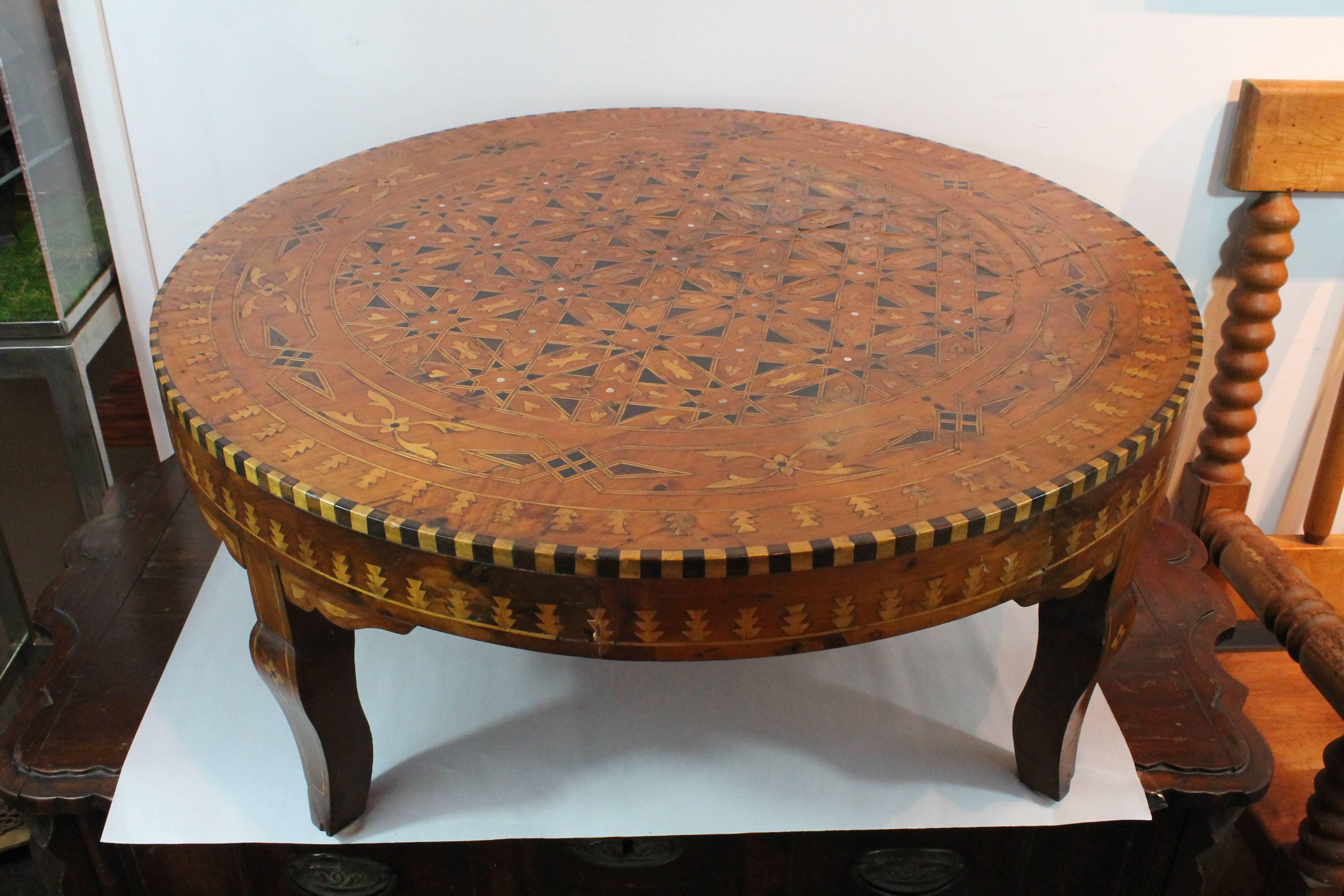 Exceptional inlaid marquetry Moroccan table.
Mother of pearl and multiple different woods combined in a very graphic design.