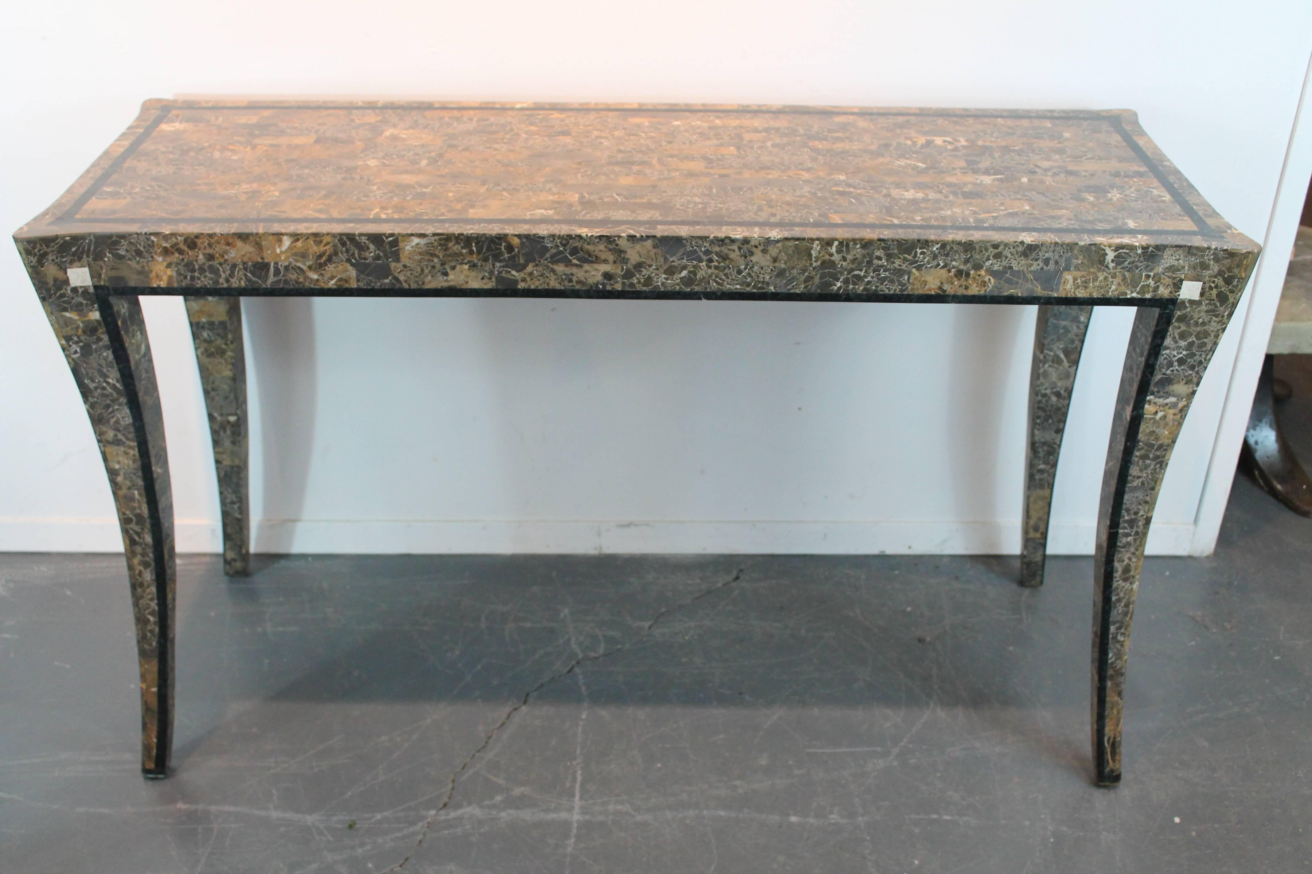 Remarkably elegant lines and exceptional attention to detail in this tessellated marble console table by Maitland-Smith.