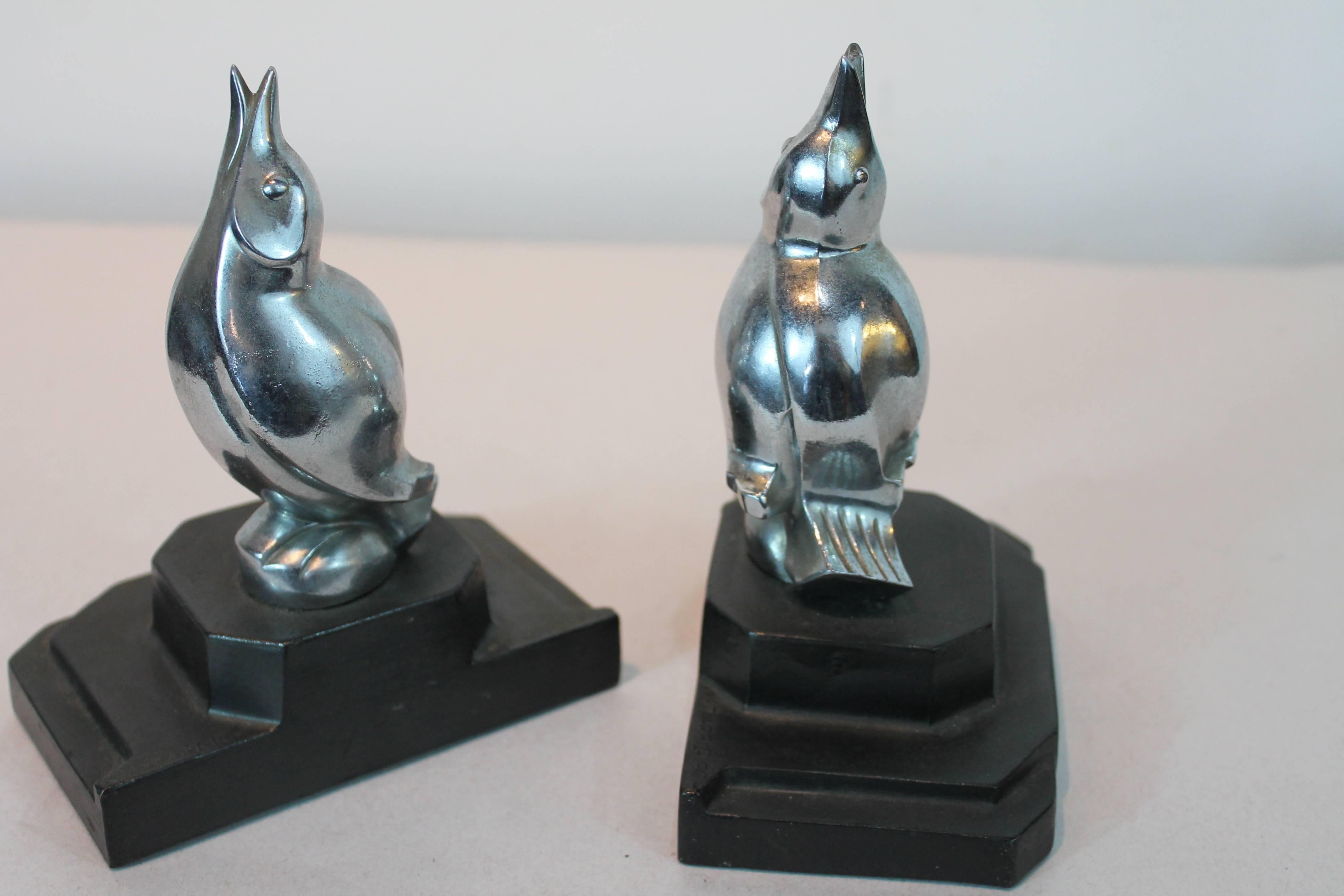 Pair of Art Deco chrome stylized bird bookends on ziggurat cast plinths.
Stamped Frankart.