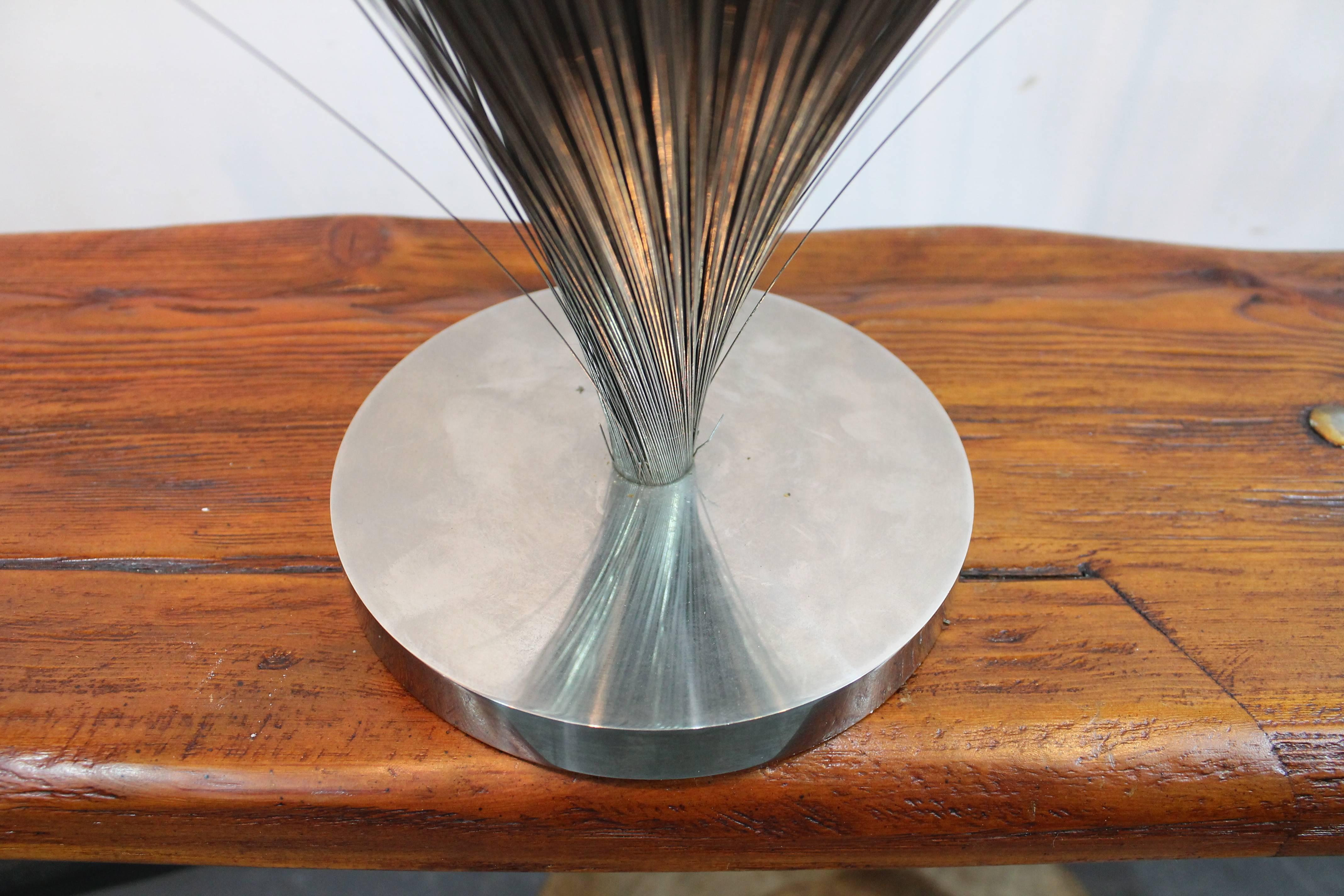 Wonderful iconic mid-20th century spray sculpture after Bertoia by Tom McAllister. Stamped on the bottom McAllister Tanzaz Ca and stamped on the side of the base TMW with a copyright mark.