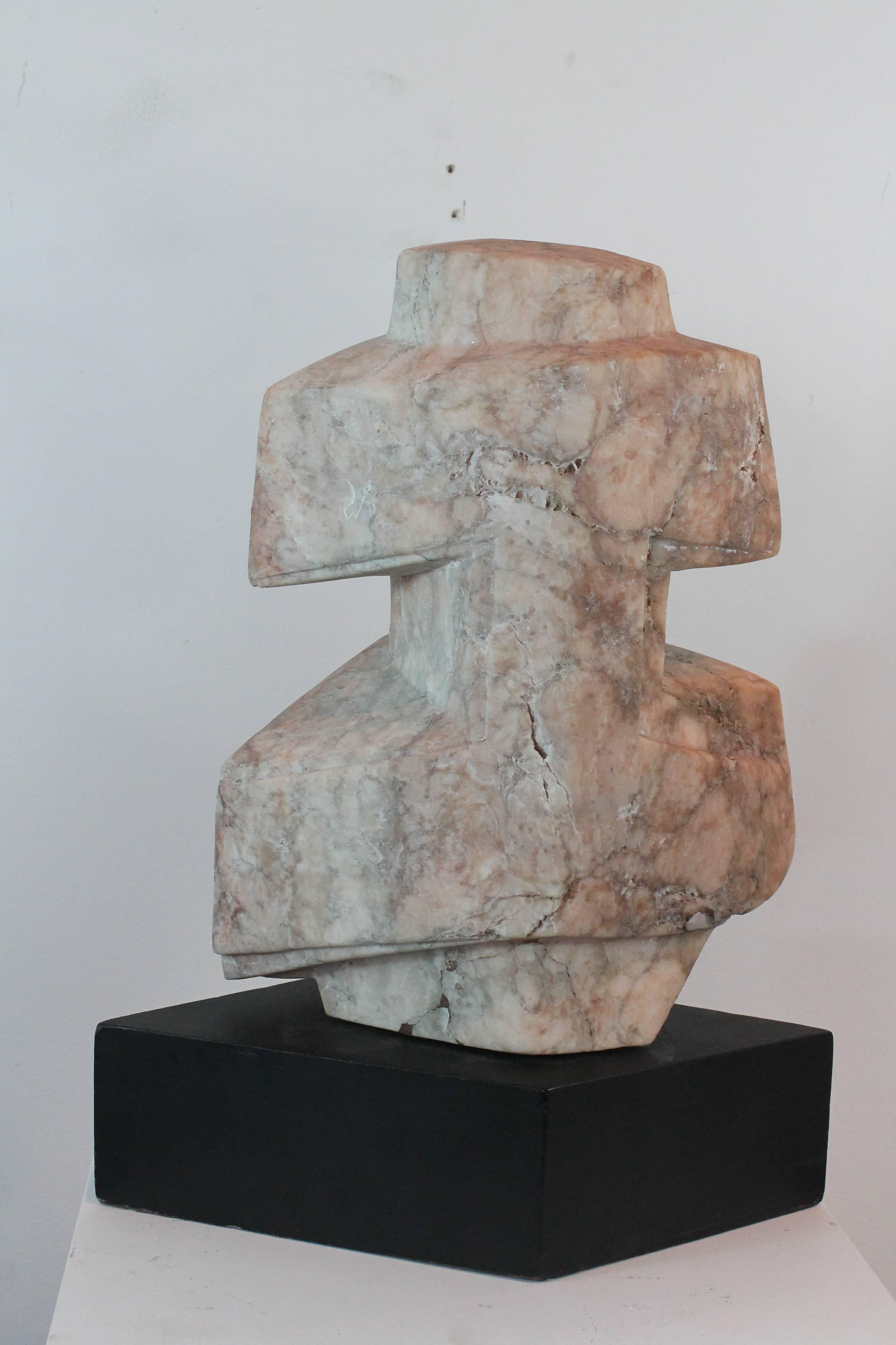 Evocative angular carved Italian pink marble sculpture.
Great from every angle. Wonderful cubist faceted surface.
Set upon an ebonized angular plinth.
  