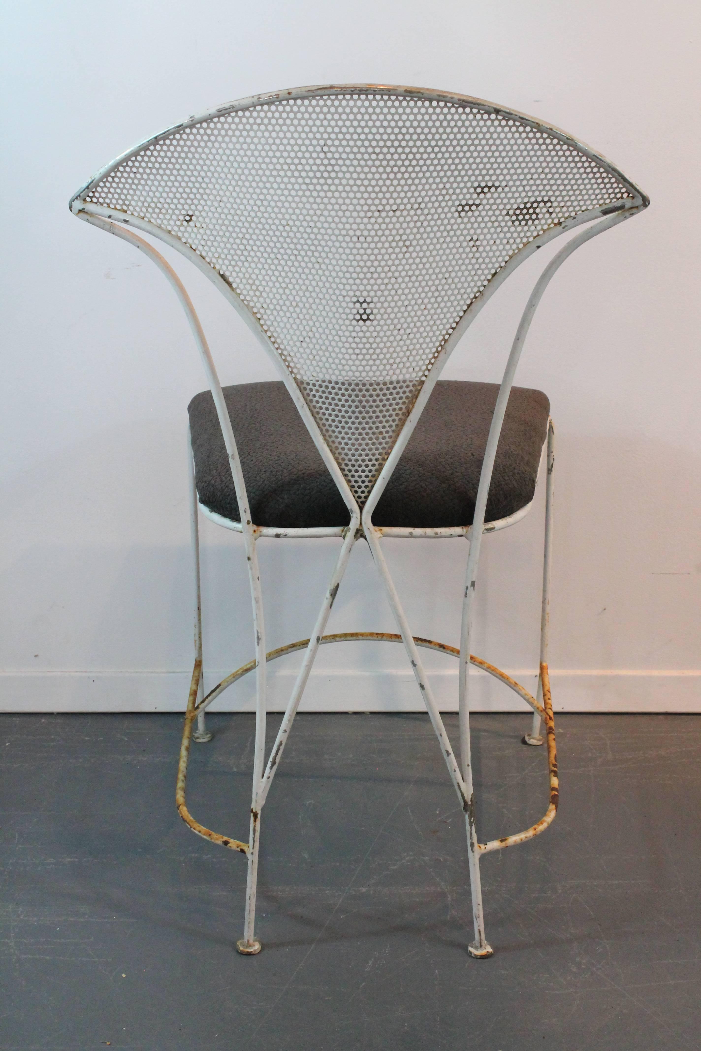 Wonderful perforated triangular backs on this set of four iron sculptural chairs.
Exceptional lines on the back with the x pattern and the curved leg supports.
Oxidation and rust throughout, likely used as garden chairs.
Newly reupholstered.