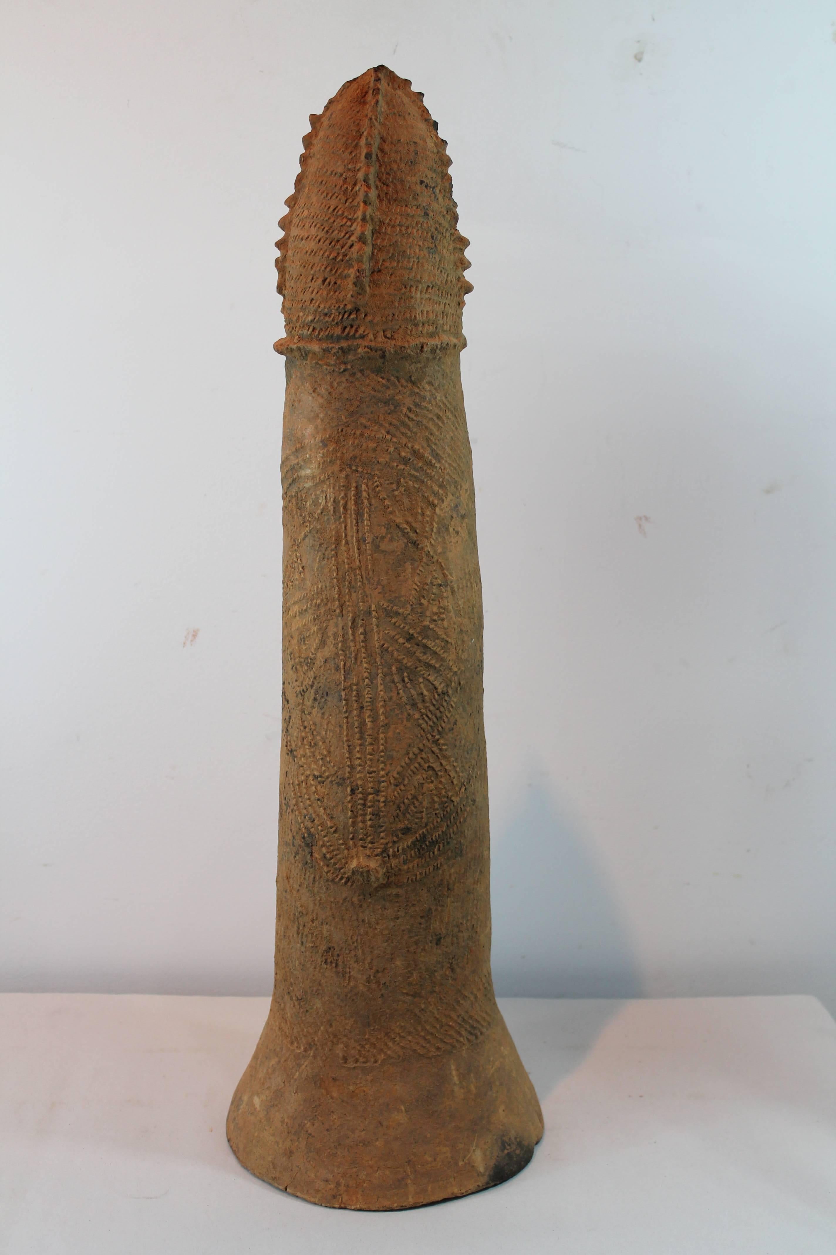 Bura Civilization, Niger (3rd-11th century) terracotta phallic form vessel.
These funerary conical form pots were buried upside down in graves and contained personal items.
Wonderful incised decoration.
These base of this vessel is in excellent