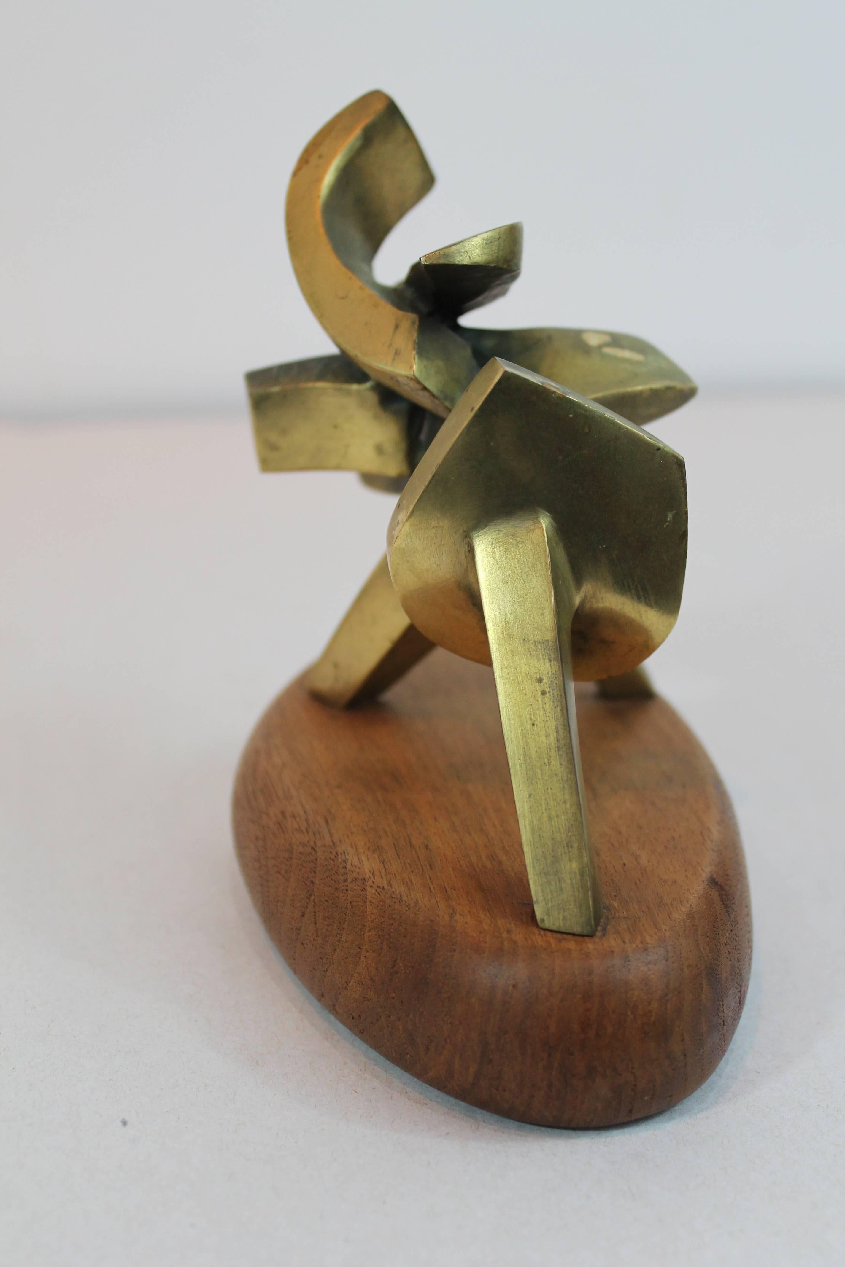 Diminutive Mid-Century tabletop abstract bronze Modernist sculpture.
On an oval wood plinth.
Unsigned.
 