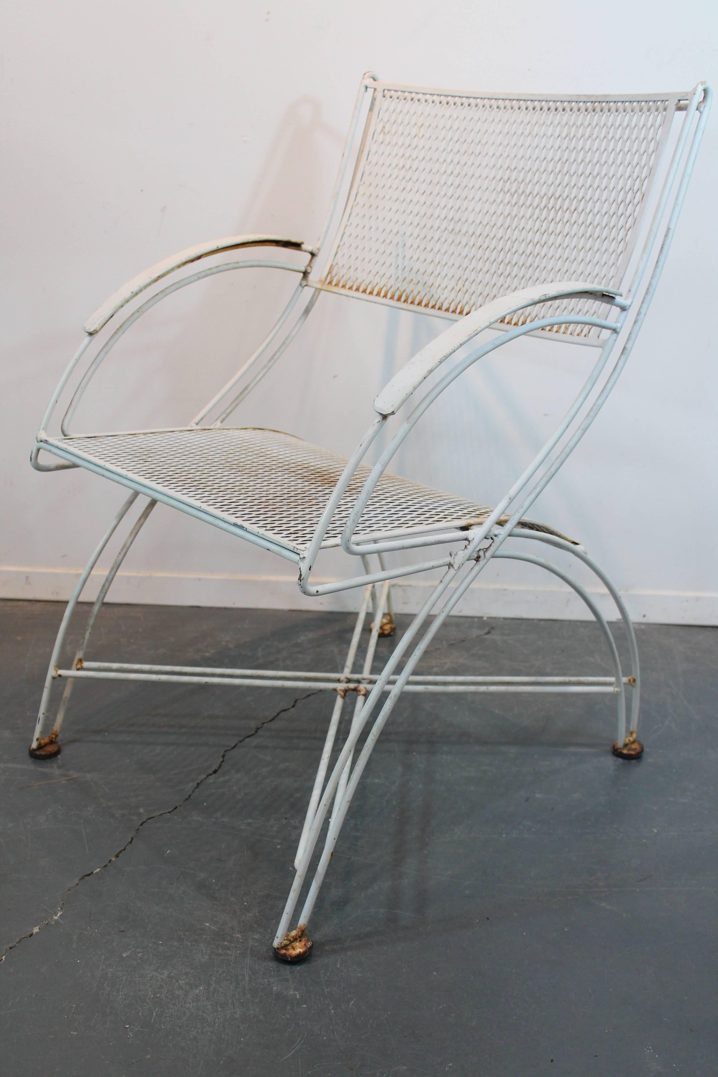 Very sculptural set of Mid-Century Moderne iron garden chairs.
Incredible profile.
We also have the pair of matching benches.
  