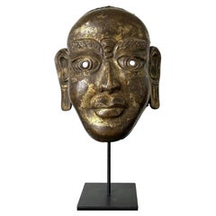 Tibetan Gilt Copper Alloy Mask on Display Stand