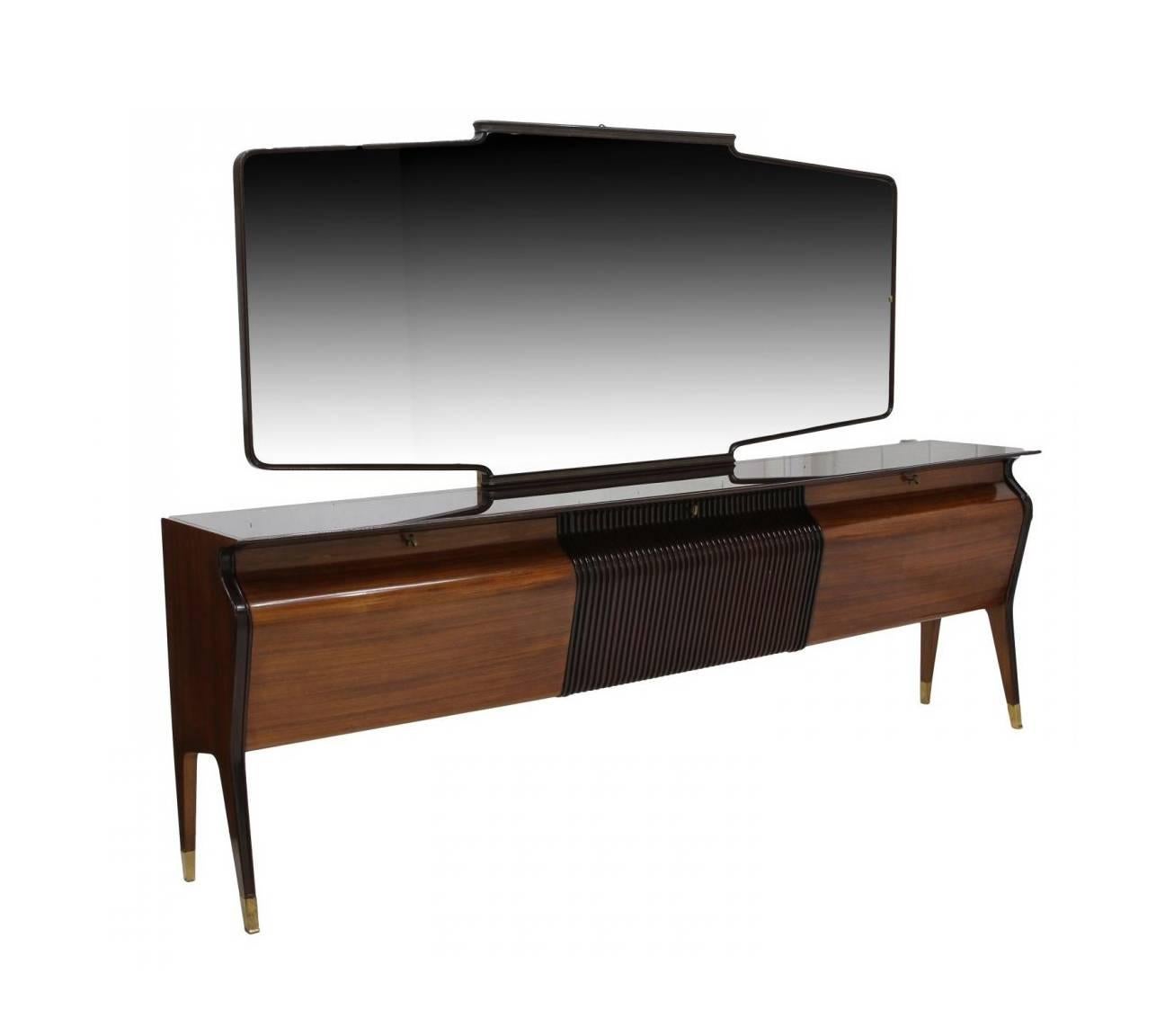 A very large and dramatic sideboard or credenza for dining room with a matching mirror, circa 1950s. In the style of Swiss Italian Osvaldo Borsani (1911-1985), the sideboard is made of rosewood in contrast with the ebonized central panel. It