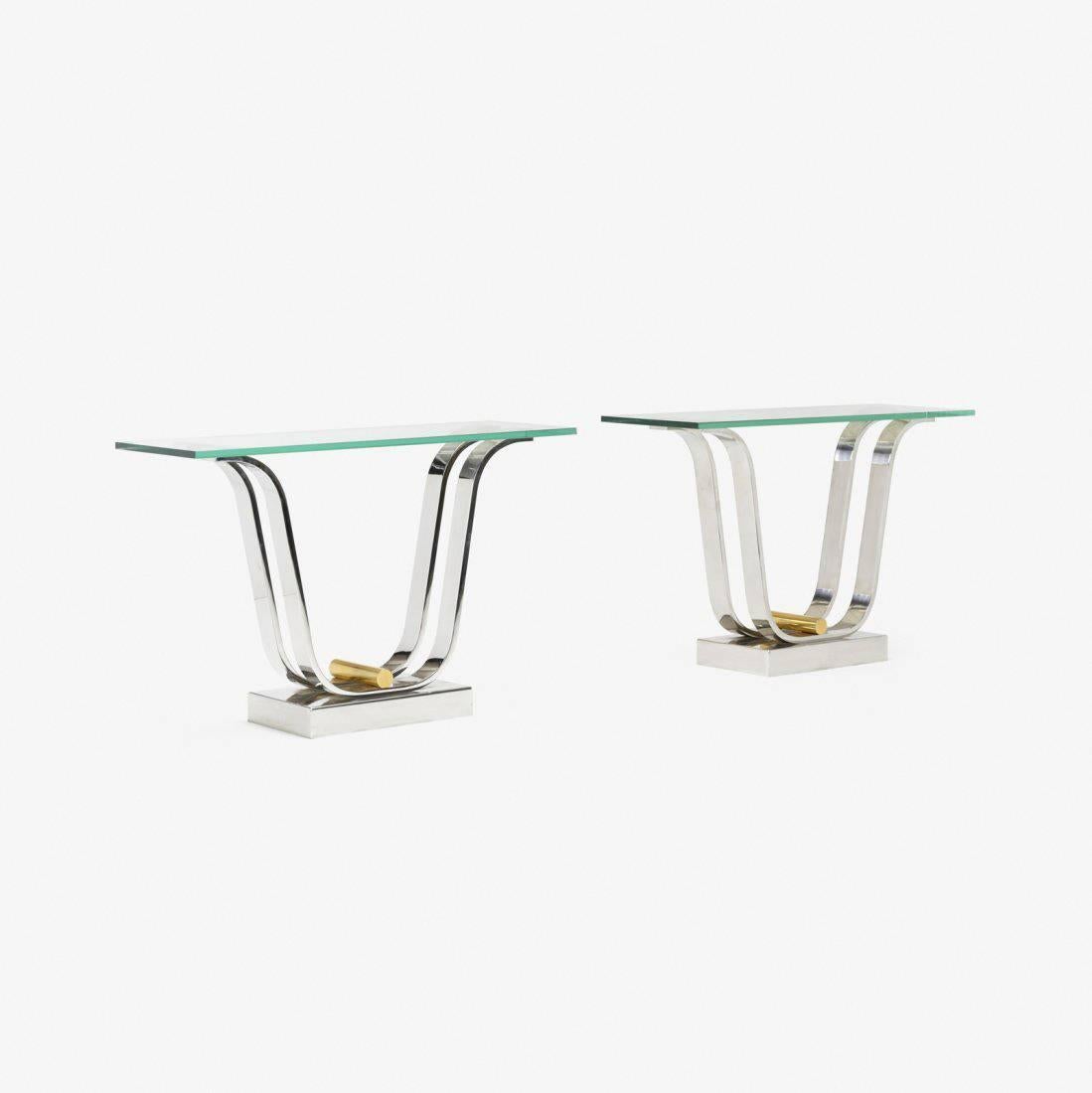 Pair of authenticated tulip table bases designed and manufactured by Karl Springer, Ltd. The bases are currently configured as a pair of console tables with glass tops, but they can also be used as dining table bases to support a large glass top.