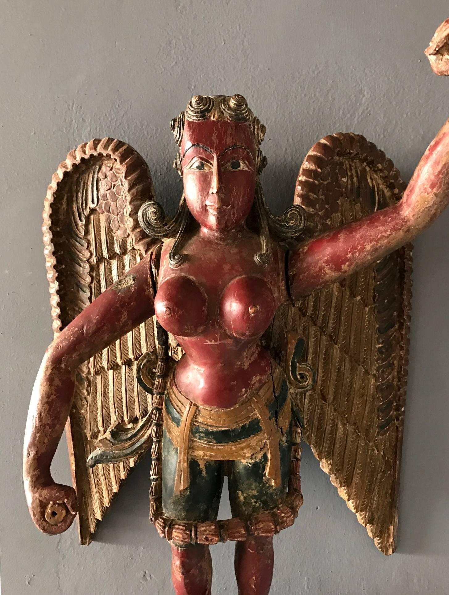 winged deity