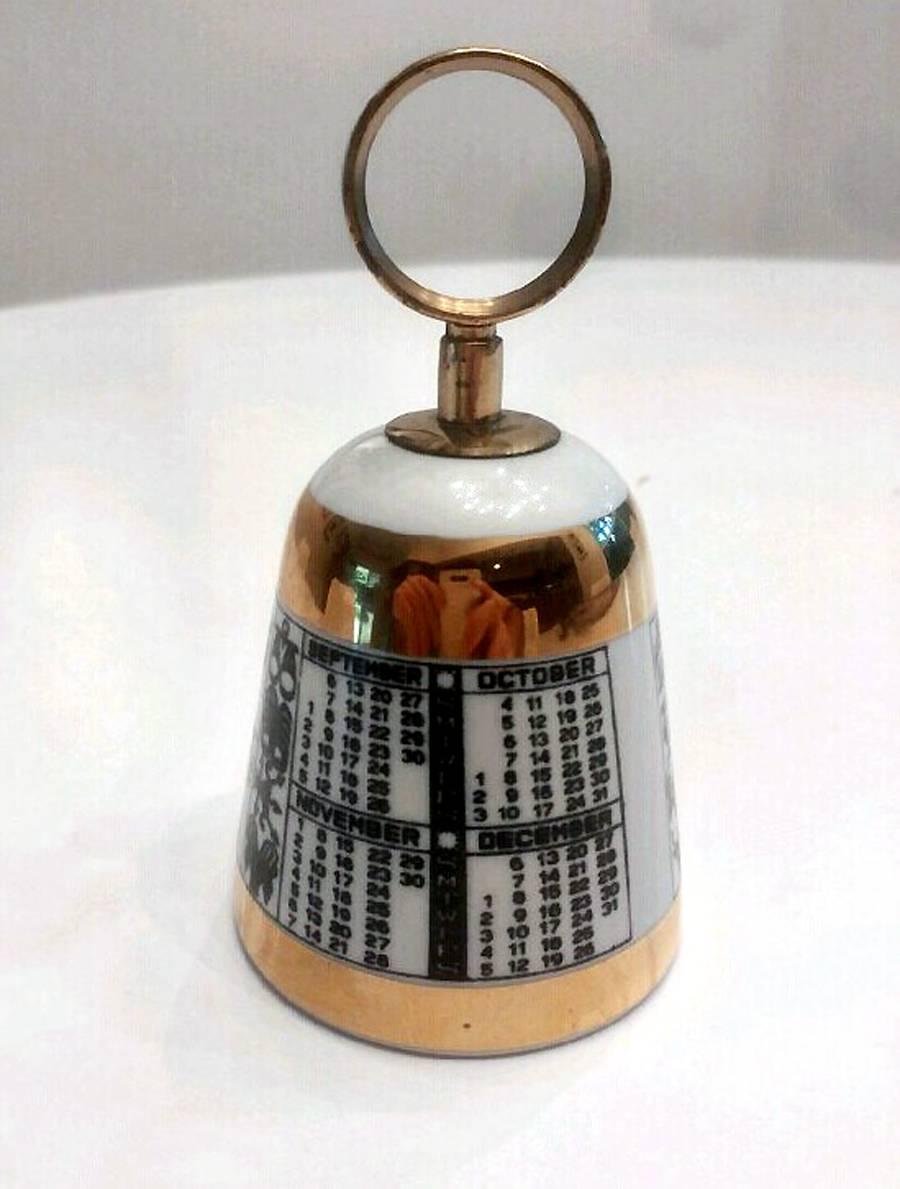 A wonderful design from Fornasetti, circa 1950s, this bell is made of porcelain with calendar design and gilt trim. The brass holder cap the bell while the brass pendant ball gives out great sound when shaken.
 