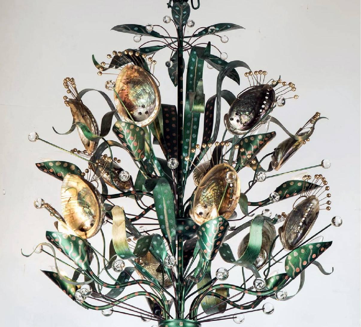 Originally designed and handmade by Tony Duquette for his solo exhibition in Los Angeles in 1952, the abalone chandelier exemplified Duquette's affection for things glamorous and exotic. After the exhibition, the chandelier was moved to the Charles