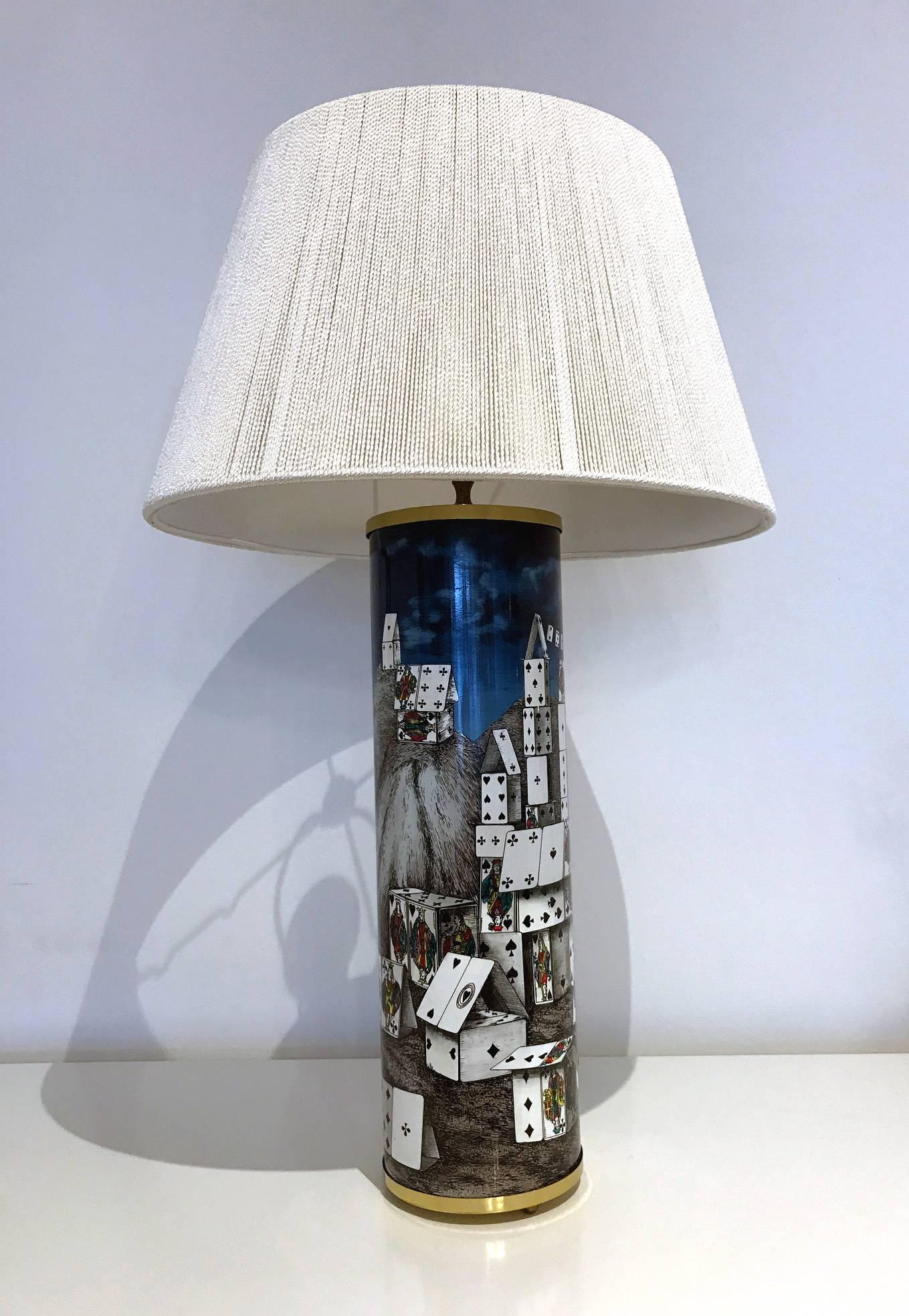 A beautiful assembled pair of table lamps by Fornasetti circa 1960s. Decorated with one of the most iconic designs theme "House of the Cards".
One is inscribed No 2/97 F.O, the other  No. 6/93 - F.O. Both have paper label underneath. One