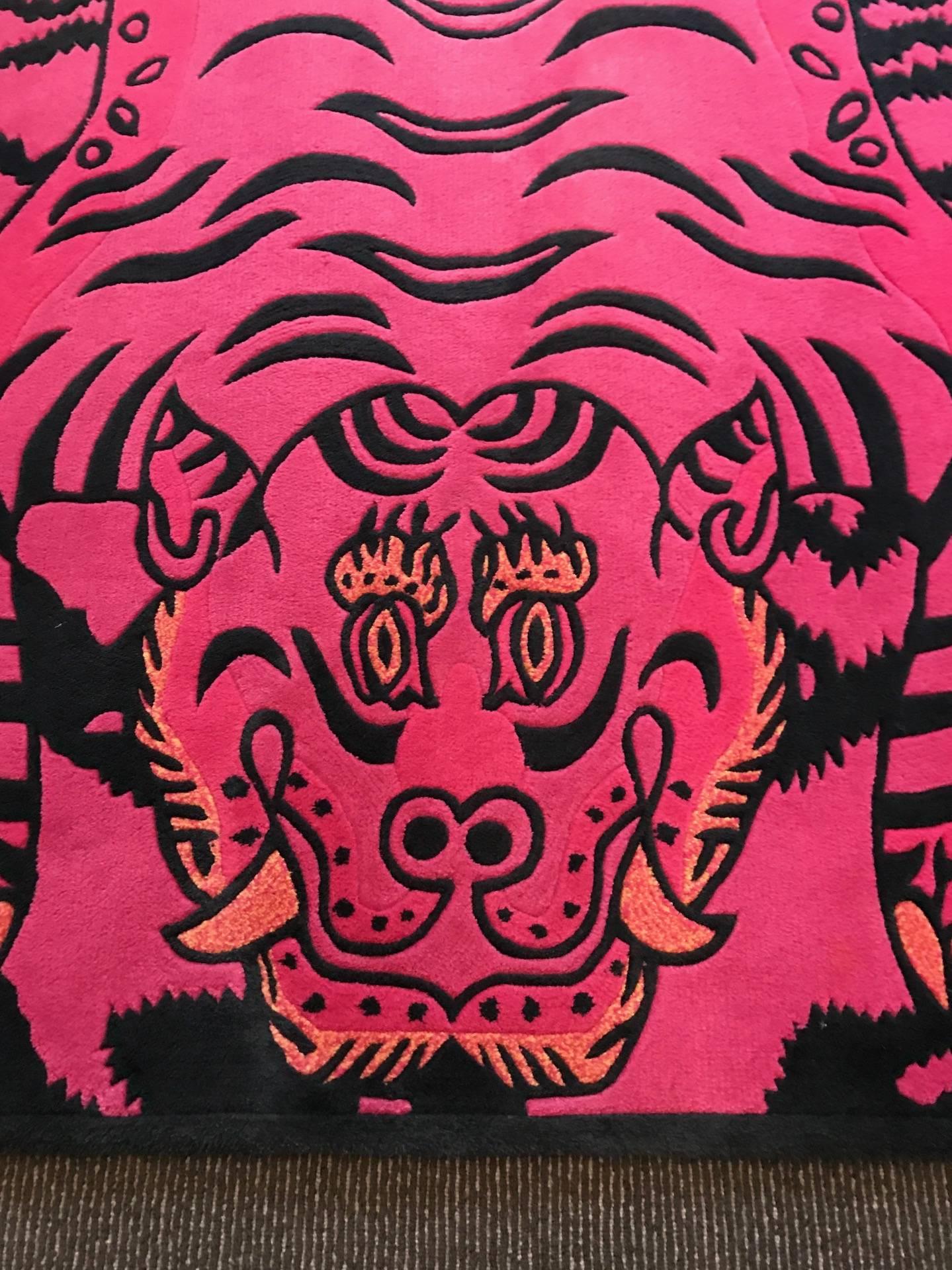 A fantastic area rug custom-made by Swiss architect and designer Carlo Rampazzi for a project in NYC. A new and modern interpretation of traditional Tibetan tiger carpet, the rug is of amazing black and deep pink color and woven in very high