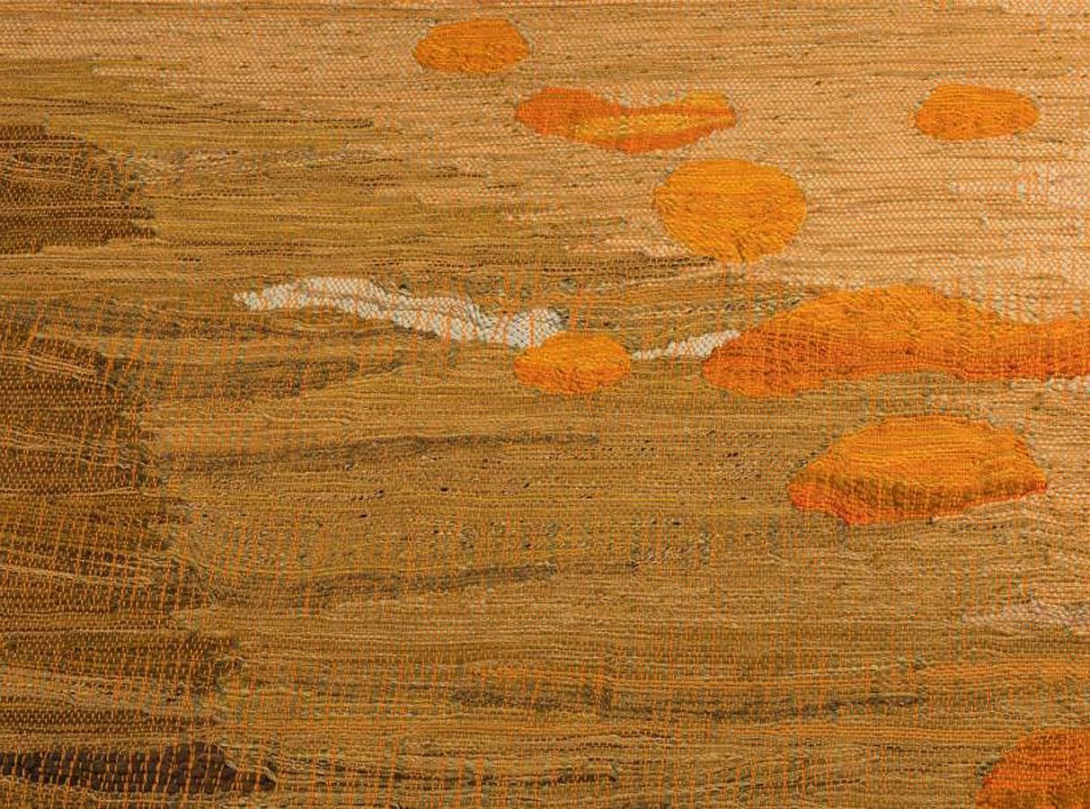 A large and beautiful modernist tapestry in an abstract design with shades of brown and orange by Simone Prouve and Andre Scholosser for Tissage Main Paris. Simone Prouve is the daughter the Jean Prouve, one of the best known French Industrial