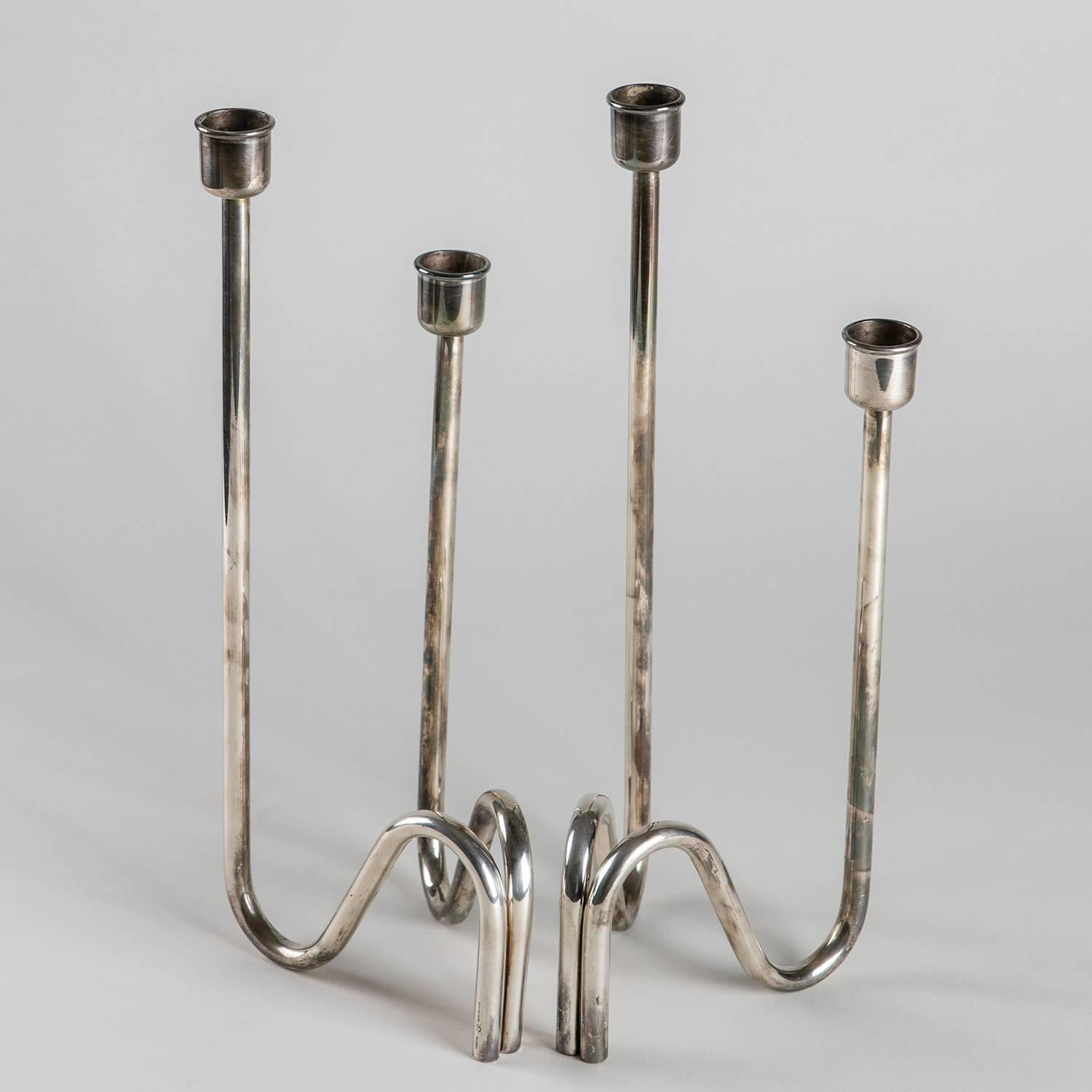 Set of two silver plated candleholder by Lino Sabattini.
