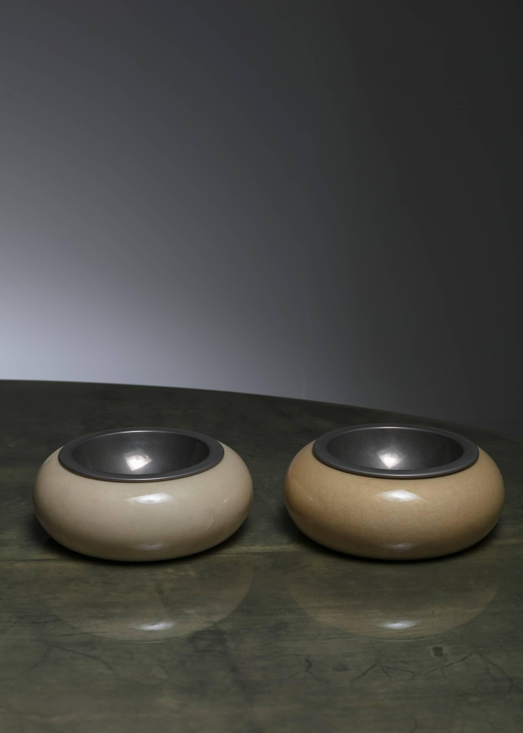 Pair of bowls by Aldo Tura.
Parchment covered wood pieces with removable metal element.