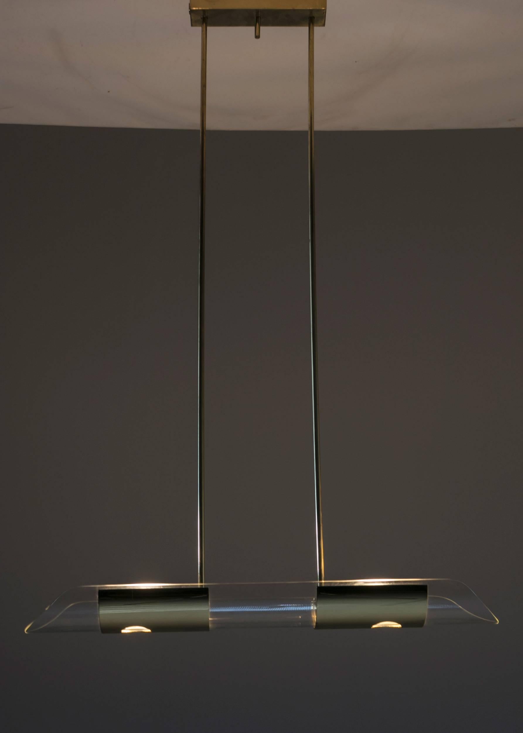Remarkable canoe ceiling lamp by Lumi with crystal body and brass details.