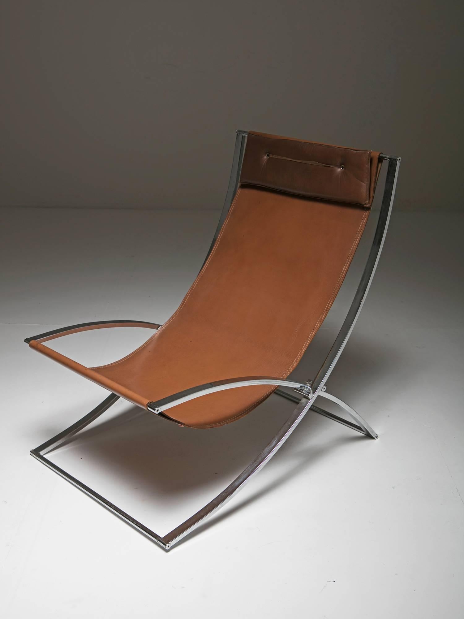 Set of two folding lounge chairs by Marcello Cuneo for Mobel.
Sleek chrome frame and leather upholstery with compact head rest pillow.