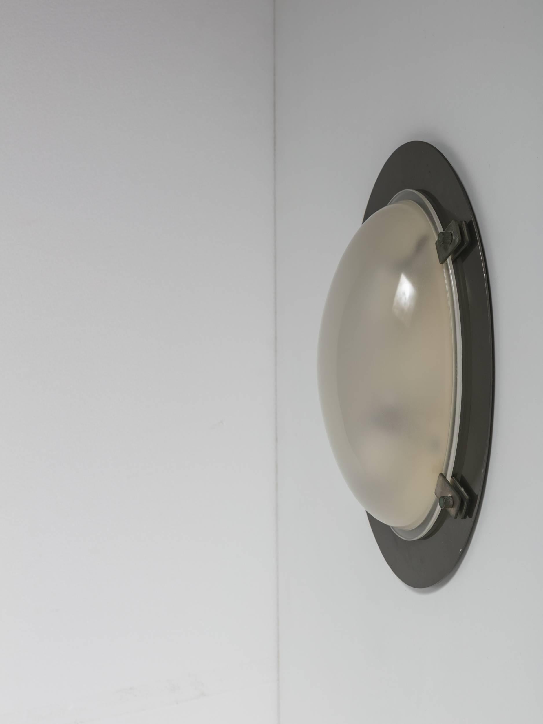 Set of two ceiling, wall lamps model Lsp8 by Ignazio Gardella for Azucena.
Nickel-plated ring with brass details carrying a frosted glass shade.