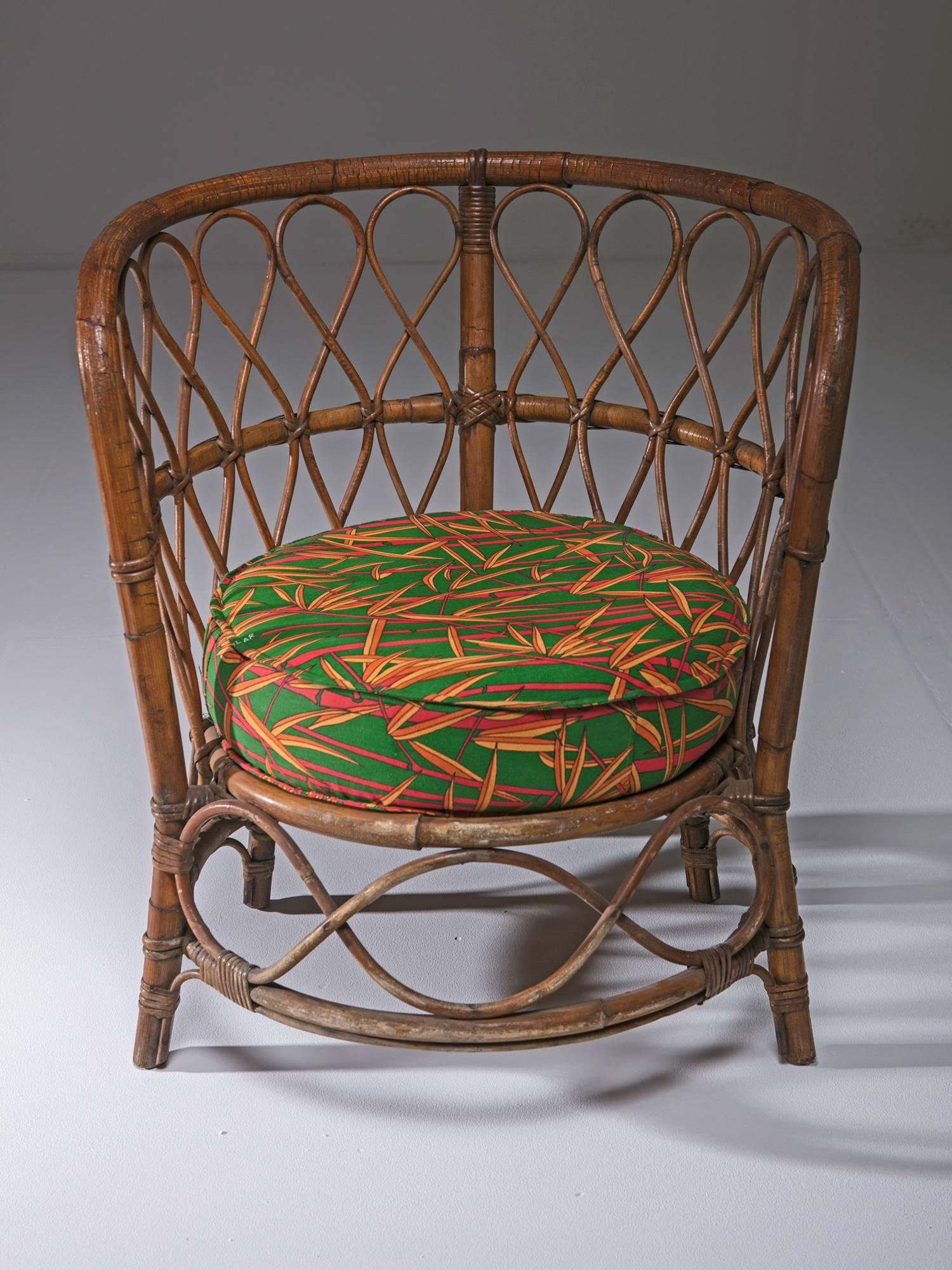 Compact wicker chairs with original upholstery.