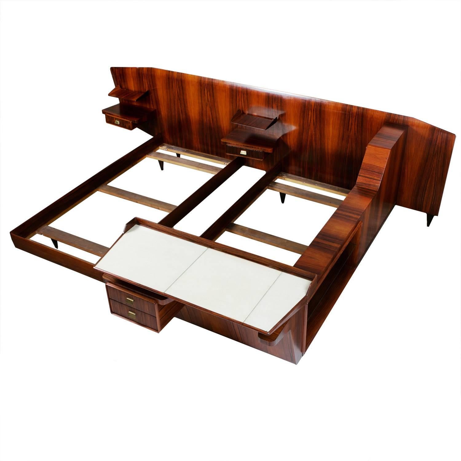 Important and unique double bed by Gio Ponti executed by Egidio Proserpio, Barzano'.
Rosewood bed with asymmetrical 