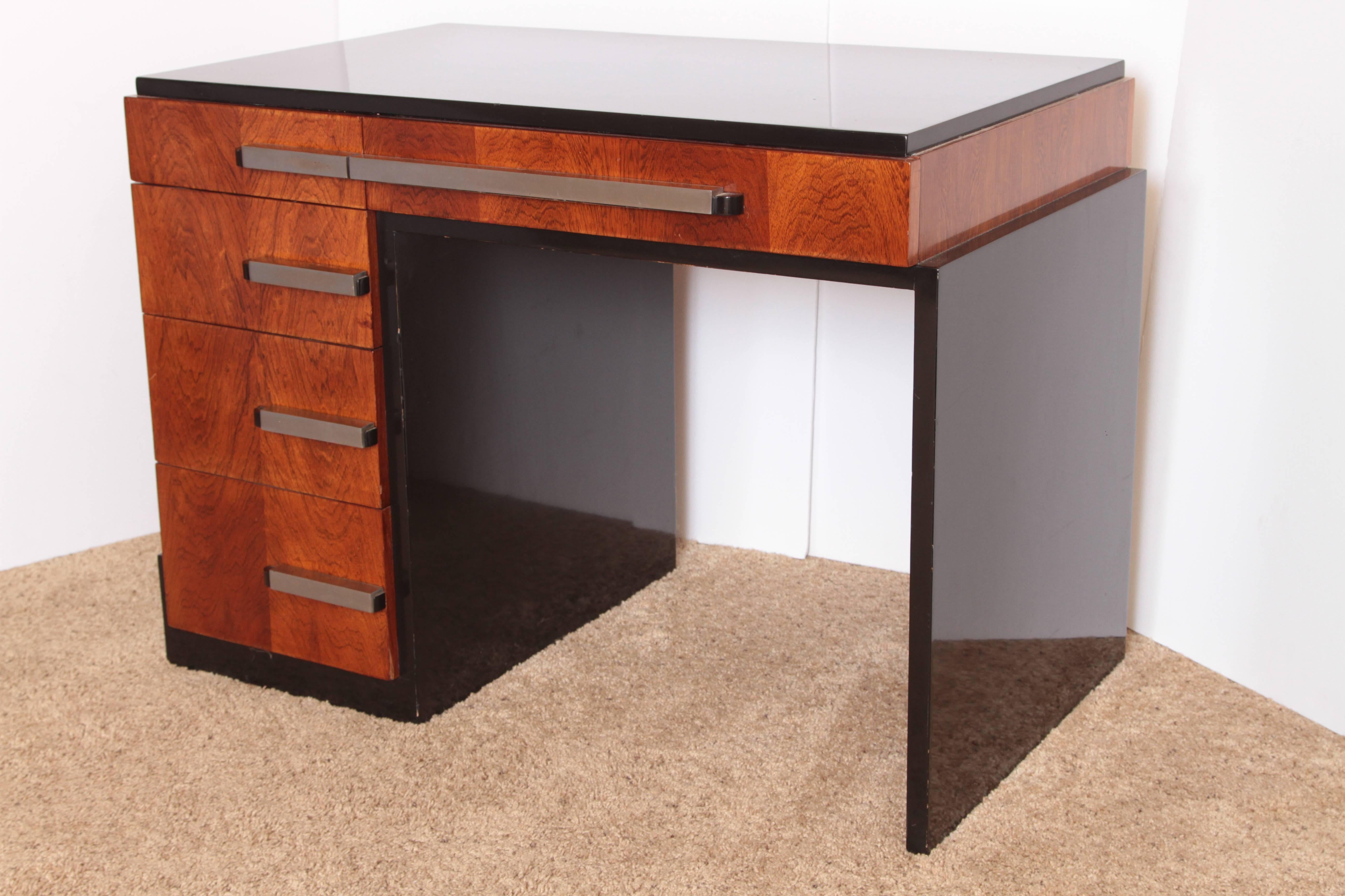 Machine Age Art Deco Donald Deskey for Widdicomb Asymmetric Desk
PRICE REDUCED

One of Deskey's most masculine offset - rectilinear designs.
Superb contrast with Black Lacquer and nicely figured Walnut Burl, cast Monel / Aluminum handles and