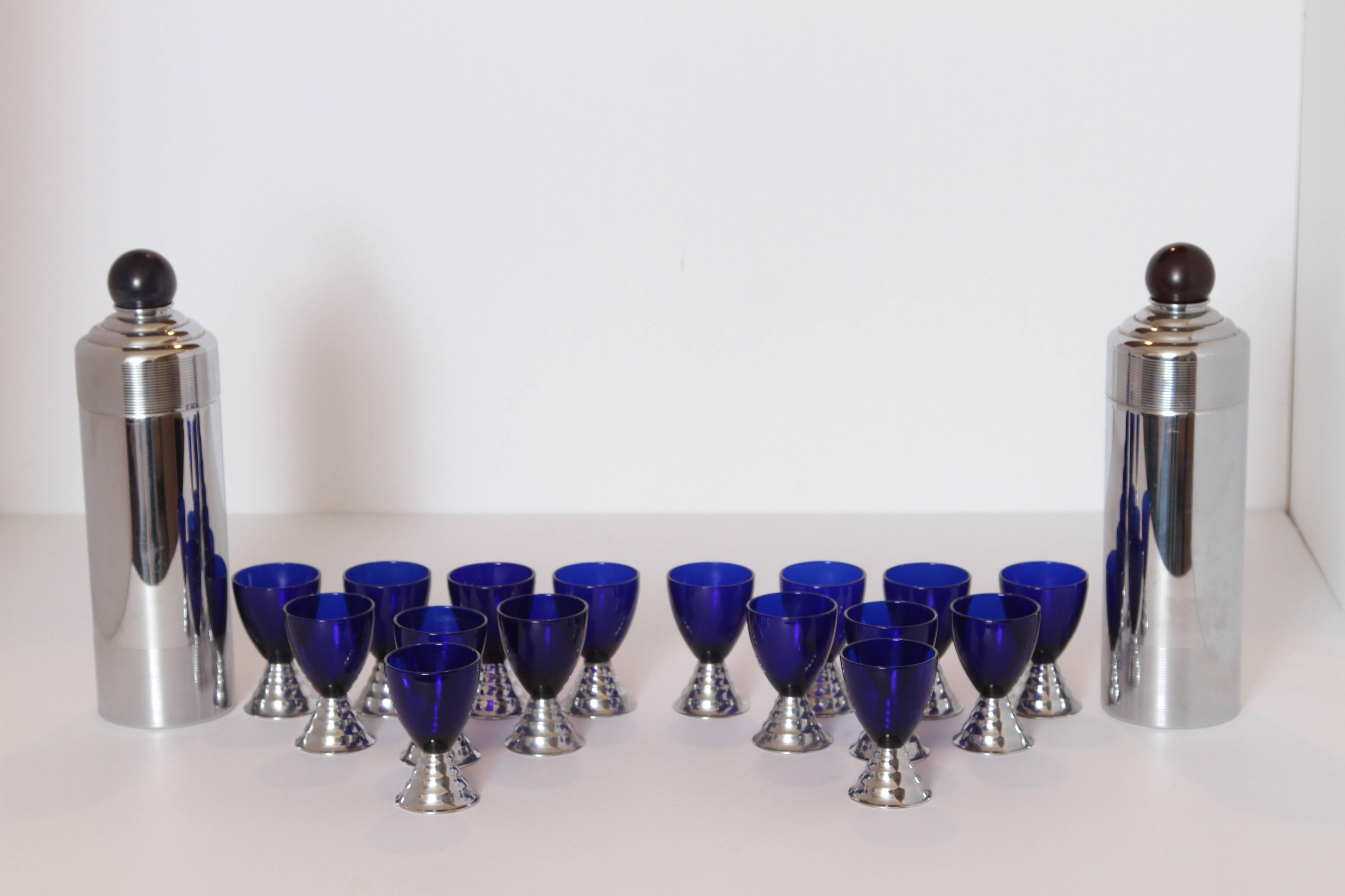 Machine Age Art Deco Chase Chrome Blue Moon Cocktail Sets (ONE SET SOLD)
PRICED PER SET

Removable deep amethyst Catalin jigger top.
Integral strainer in top cap. Nice cobalt/chrome cups. Excludes ring tray.
Set in good vintage used condition, all