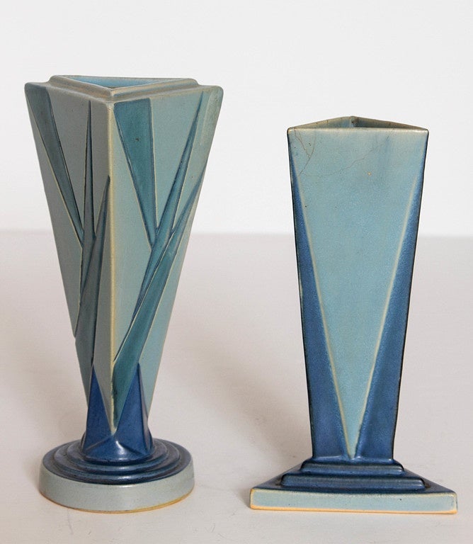 Geometric Art Deco early designs.
Skyscraper like, stepped bases with triangle motif.

Measures: #383 - 8 little blue triangle: 8.25