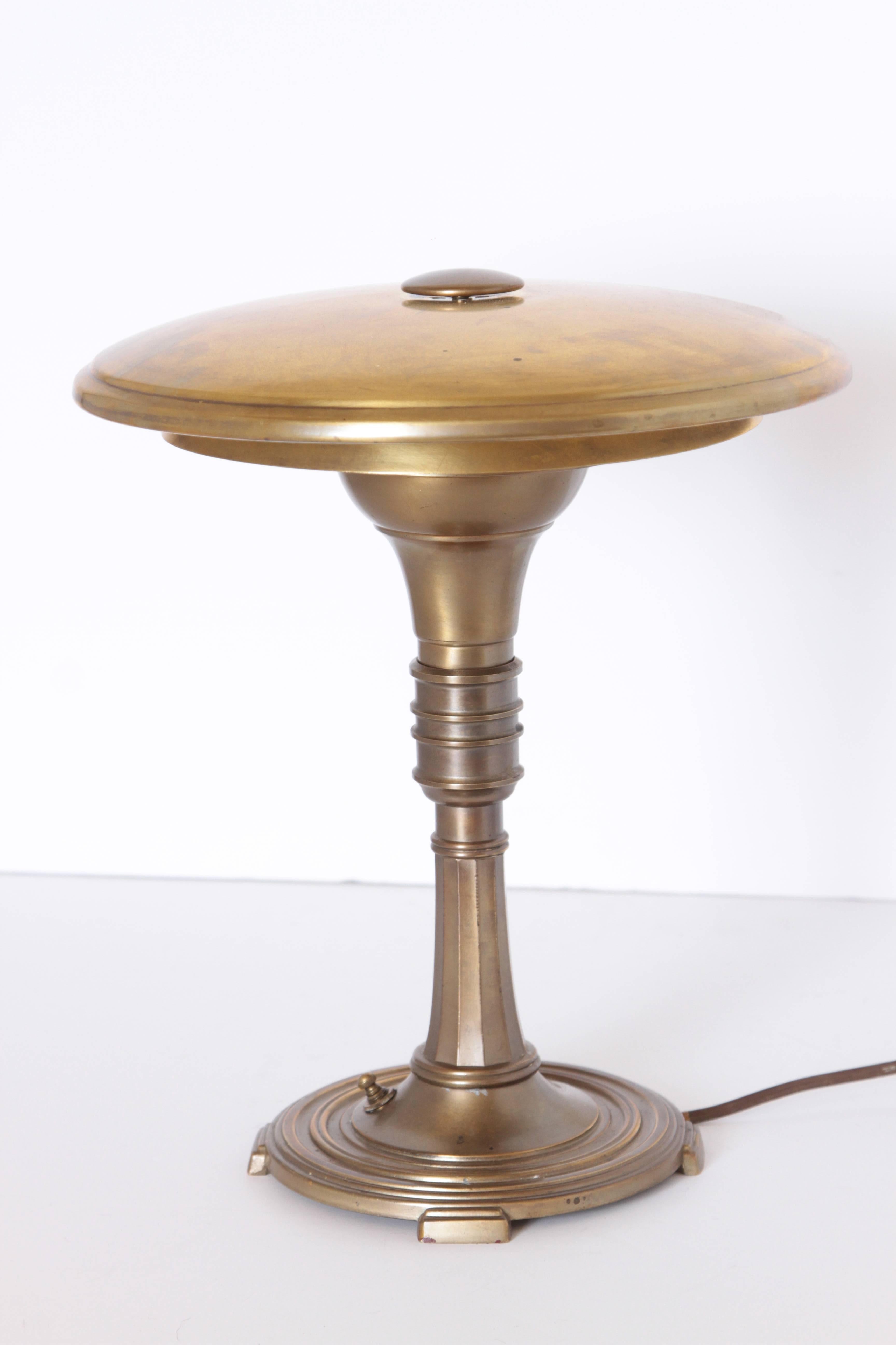 Leroy C. Doane Machine Age Art Deco sight light brass table lamp

Iconic Model # SL5 Luminaire designed by Doane for the sight light Corp, NY.
Impressed signature and Sight Light decal under weighted base.

L.C. Doane was an American indirect