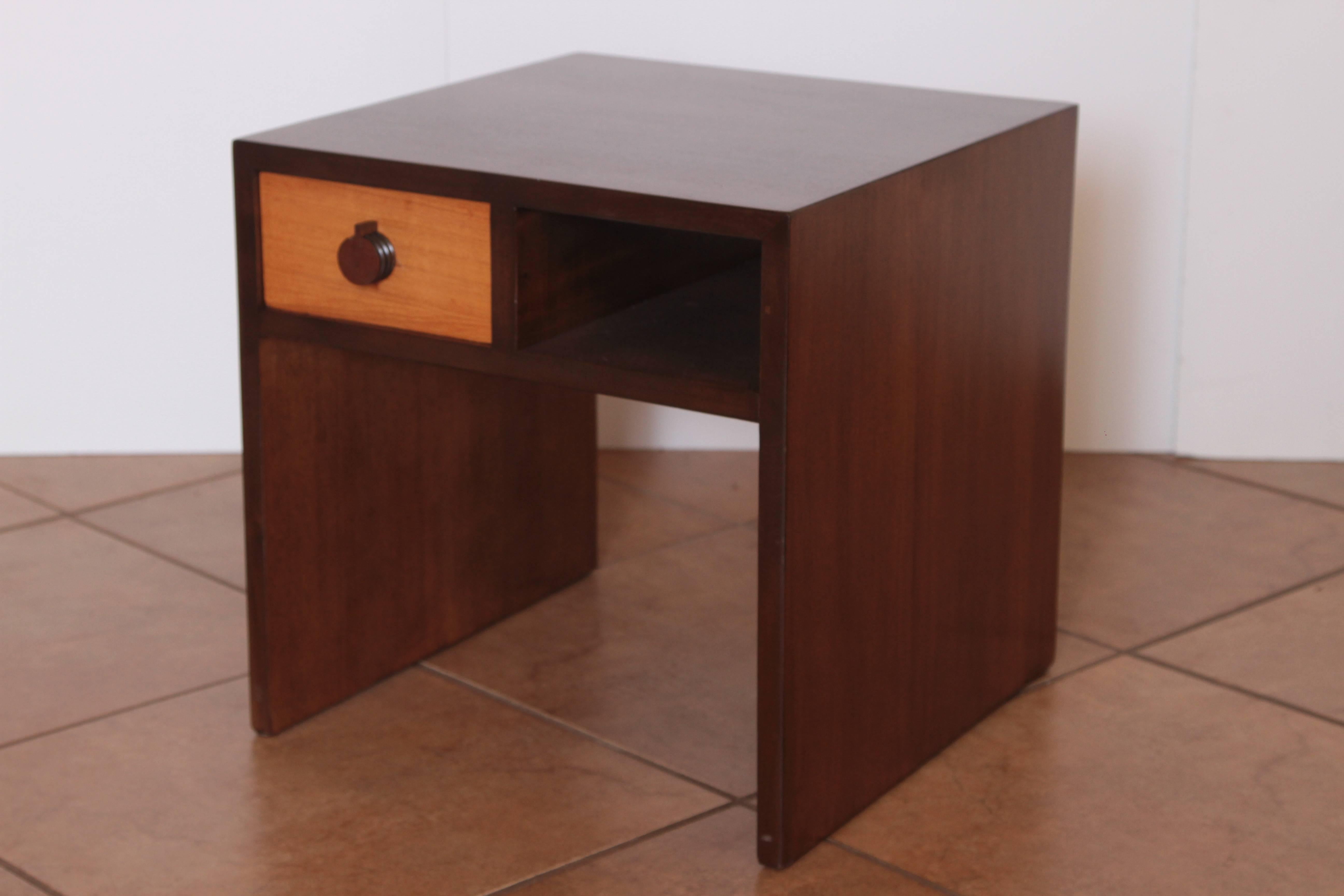 Art Deco Gilbert Rohde for Herman Miller Mansonia group occasional table.
Side table, end table, nightstand, bookcase.

Versatile compact squared rectilinear Rohde design for Mansonia (African Walnut) Group, introduced by Herman Miller in
