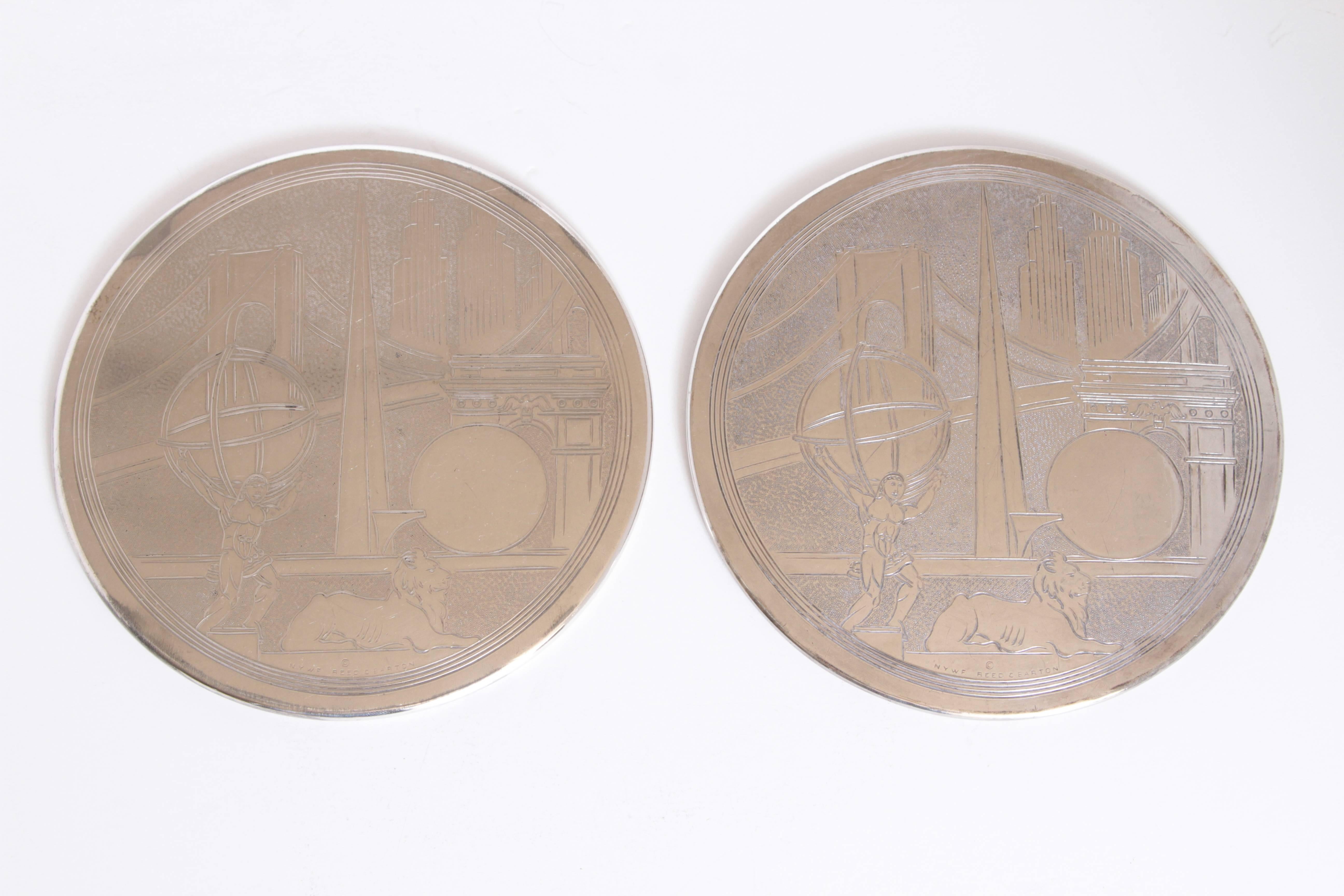 Machine Age Art Deco, New York World's fair silver plate trivets by Reed & Barton

Two rare individual serving trivets by Reed & Barton. 
Featuring incised examples of the Trylon and Perishphere, Brooklyn Bridge, Manhattan skyscrapers and