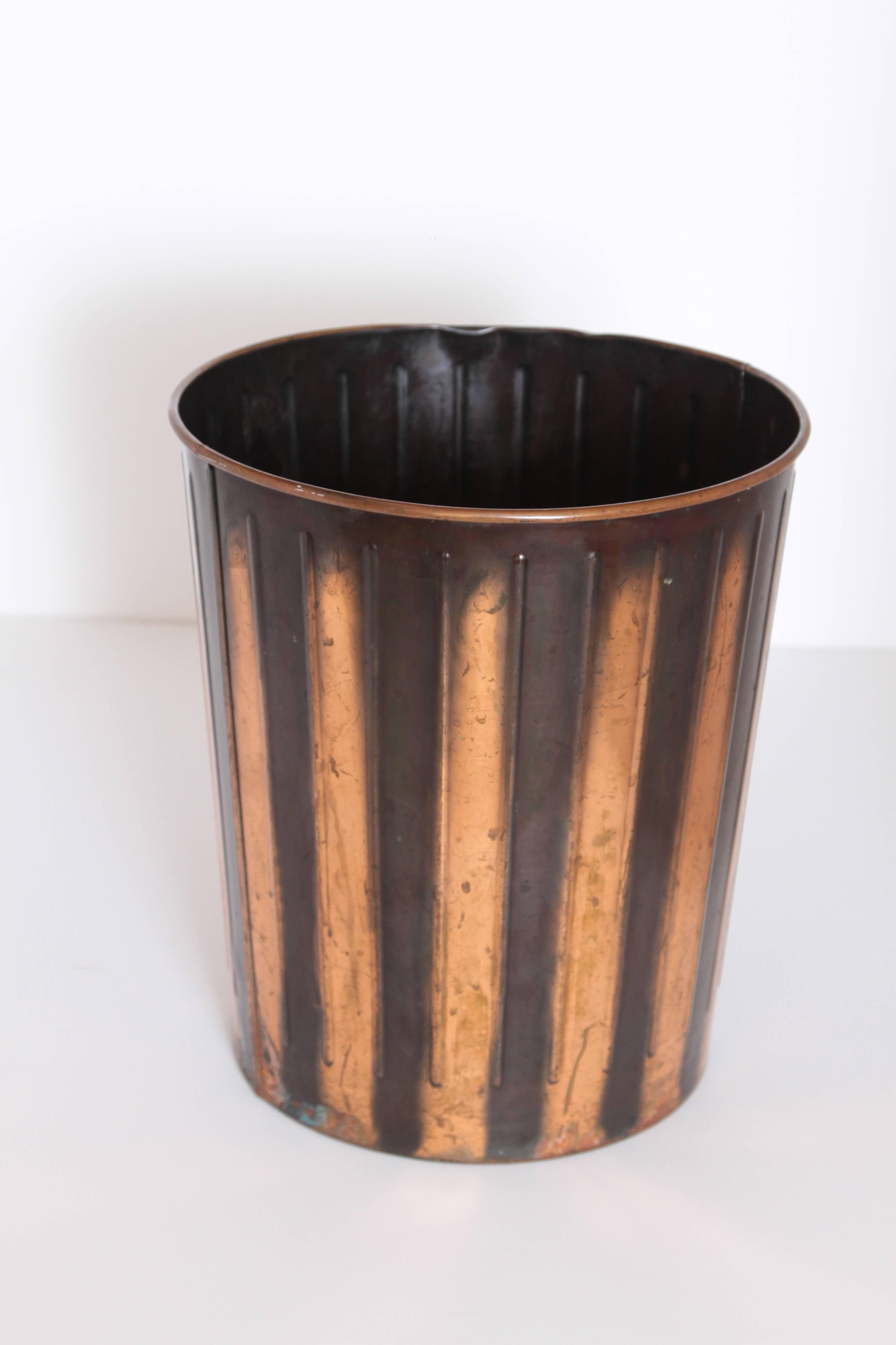 Machine Age Art Deco Industrial Arts Waste Receptacle by Erie Art Metal

Fabulous rolled-metal and ribbed construction, with excellent Japanned copper and black finish.
This is the classic DAN-DEE version #12 by Erie Artmetal Co.  Rare
