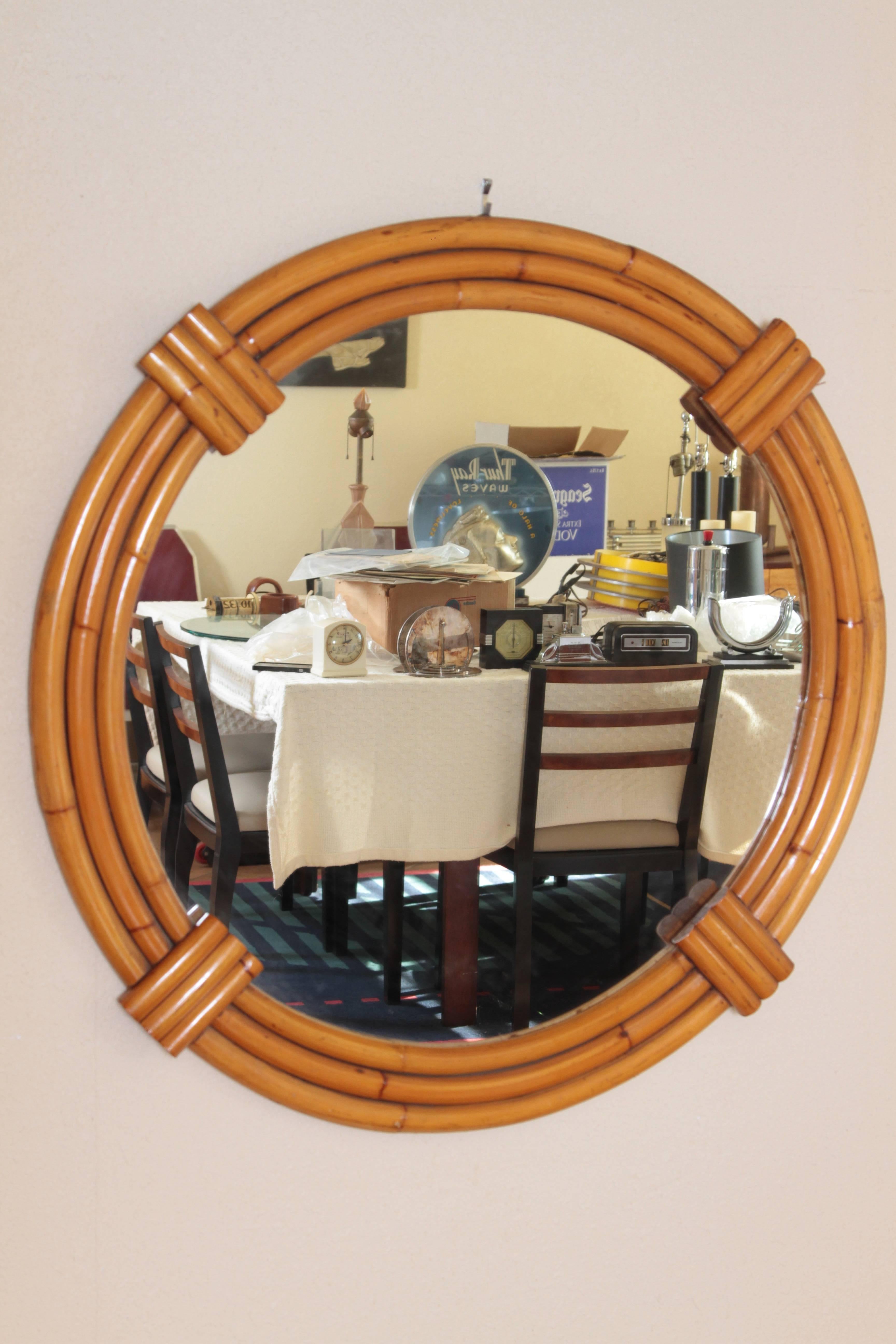 Large Art Deco streamline rattan triple - band wall mirror, manner of Paul Frankl   Streamlined Modernist

Nice large vintage example, with original patinated rattan finish.
Excellent construction, a substantial mirror with stylish art deco frame