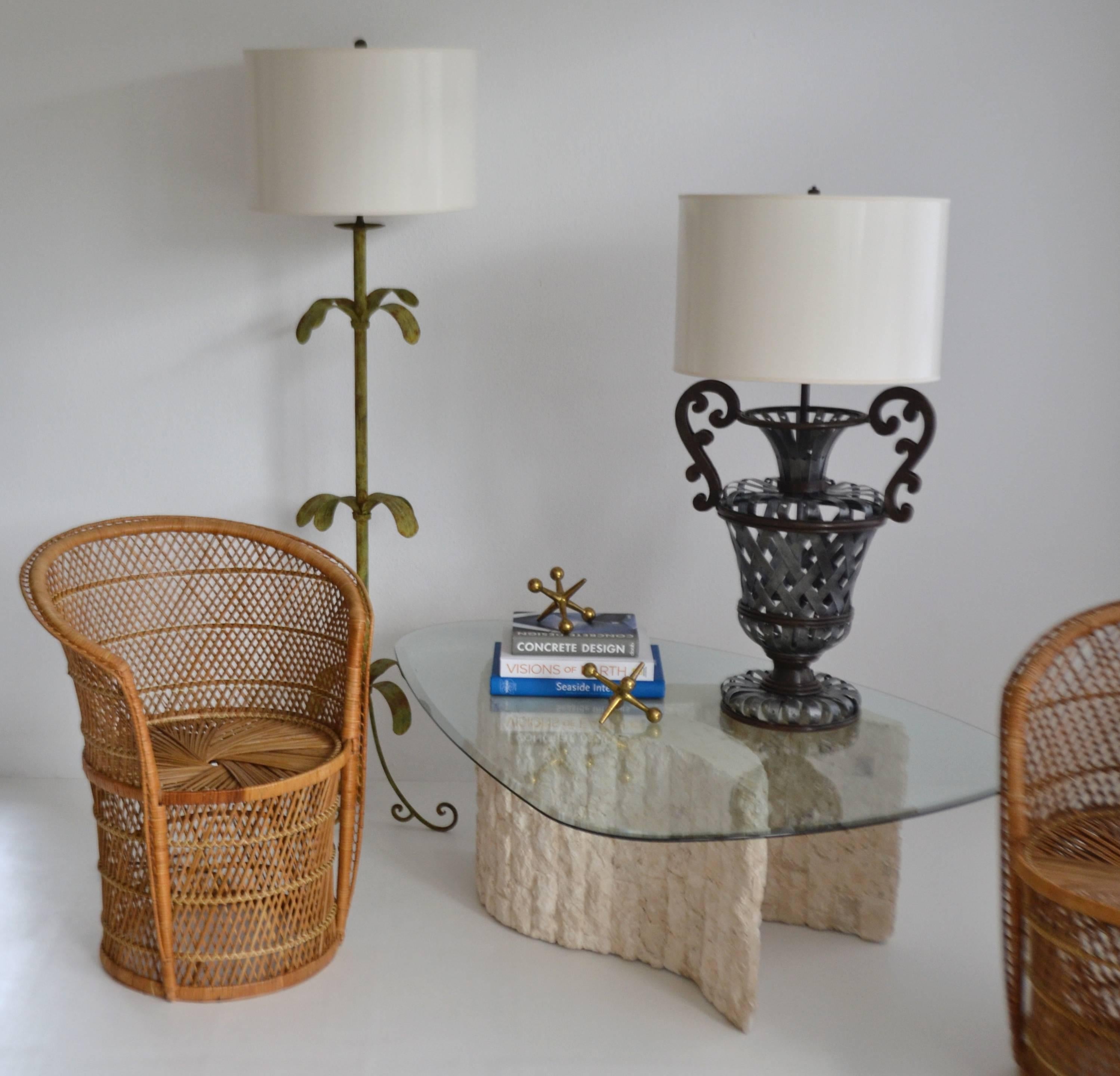 Glamourous pair of Hollywood Regency style wrought iron basket weave urn form table lamps, circa 1960s-1970s. These stunning artisan crafted hand-forged lamps are wired with brass fittings.
Shades not included.
Measurements: 
Overall: 39.5
